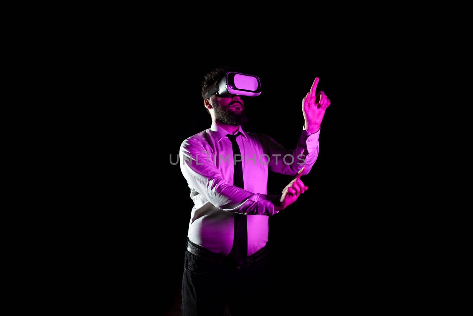 Businessman Using Virtual Reality Simulator And Gesturing During Training.