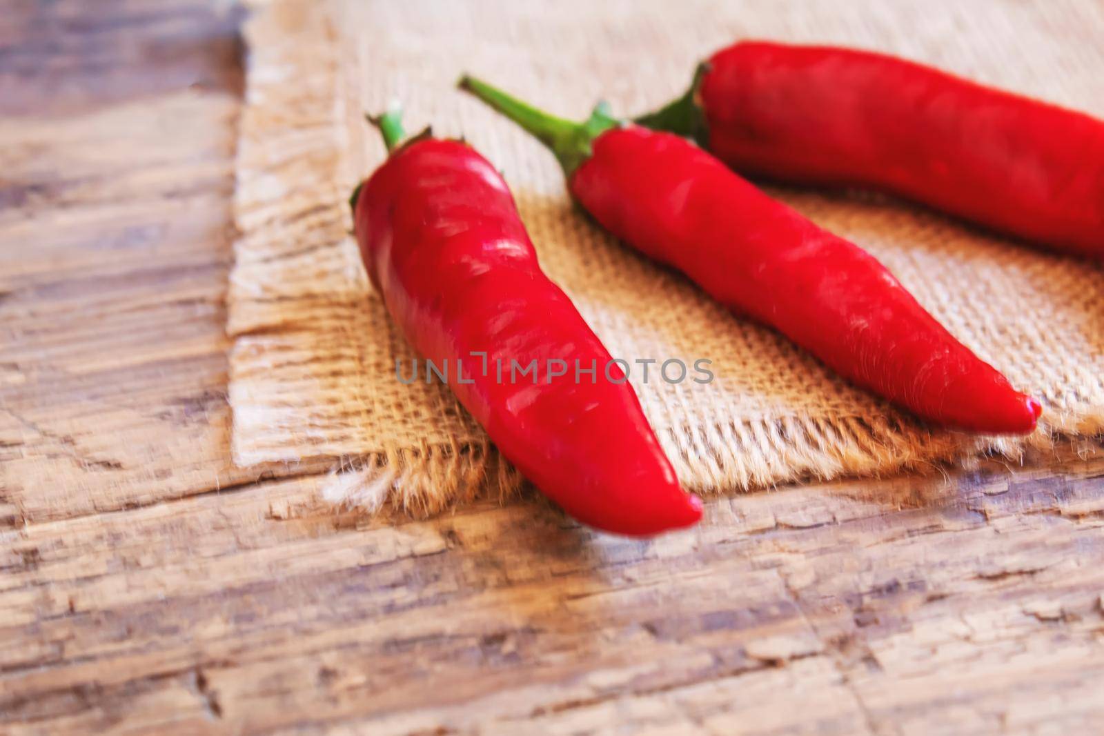 hot chili peppers on wooden background. selective focus.nature