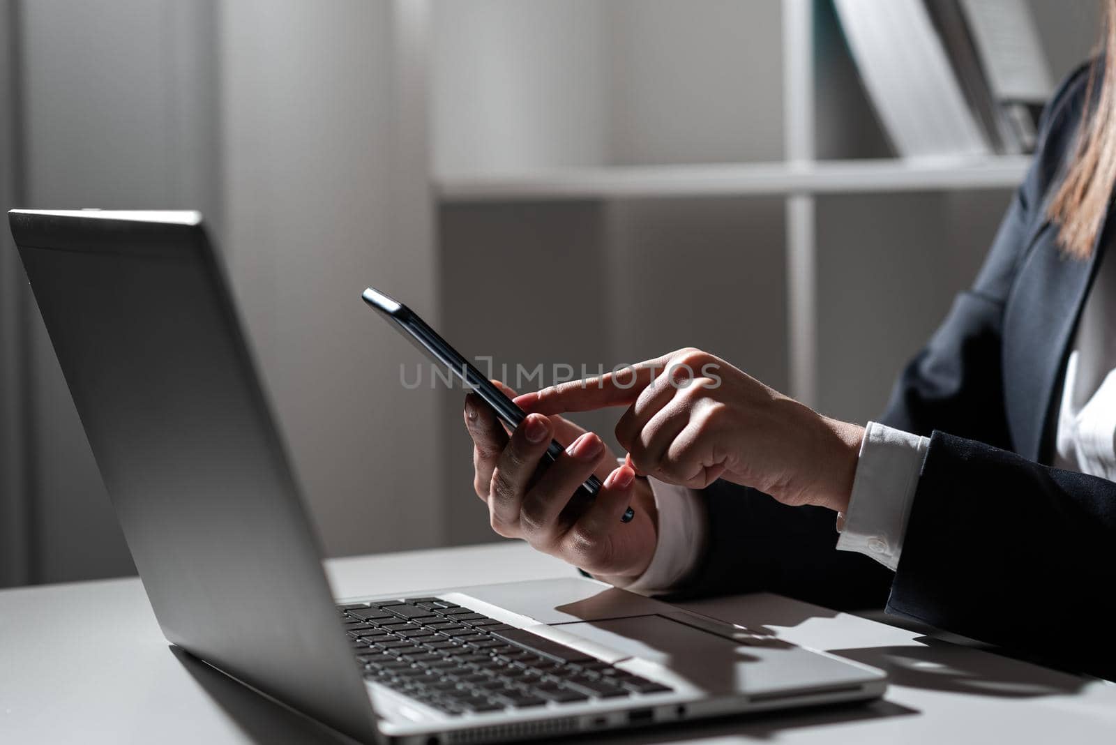 Woman Holding Tablet In One Hand And Pointing On News With One Finger.