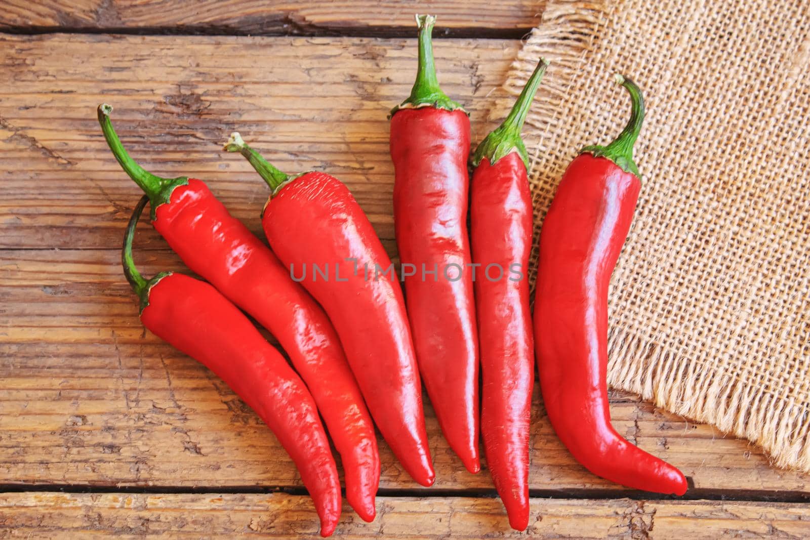 hot chili peppers on wooden background. selective focus.nature
