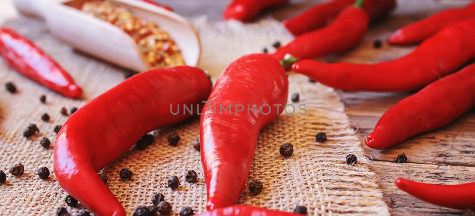 hot chili peppers on wooden background. selective focus.nature
