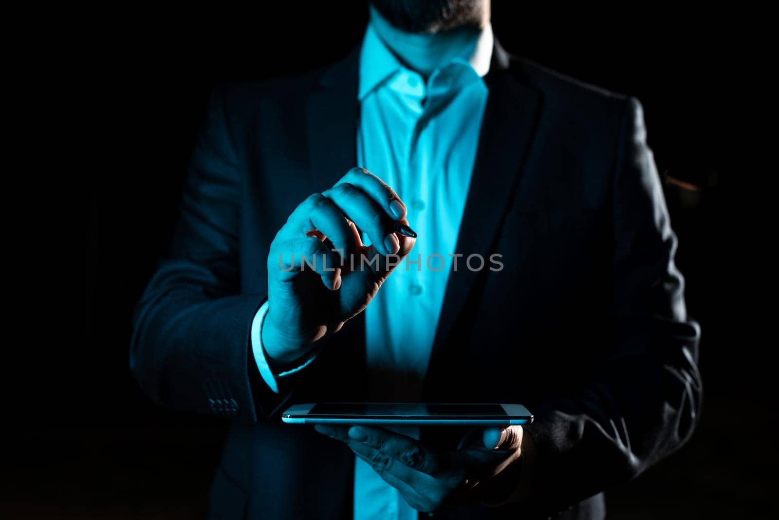 Hand With Pen Pointing Important Infortmations With Other Holding Tablet. Businessman Presenting Recent Updates. Executive Displaying Critical Messages. by nialowwa