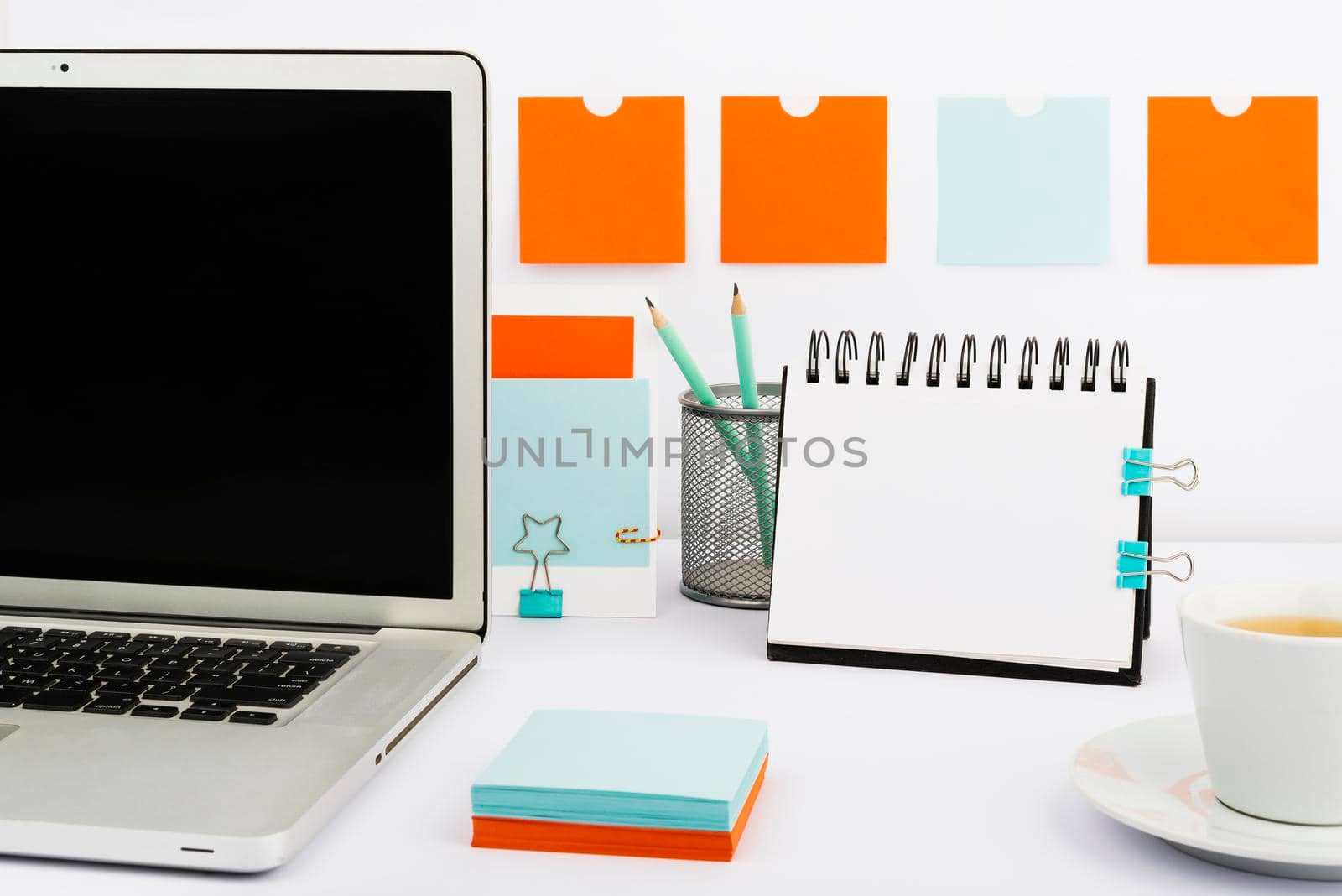 Important Messages On Notebook And Lap Top On Desk With Office Supplies.