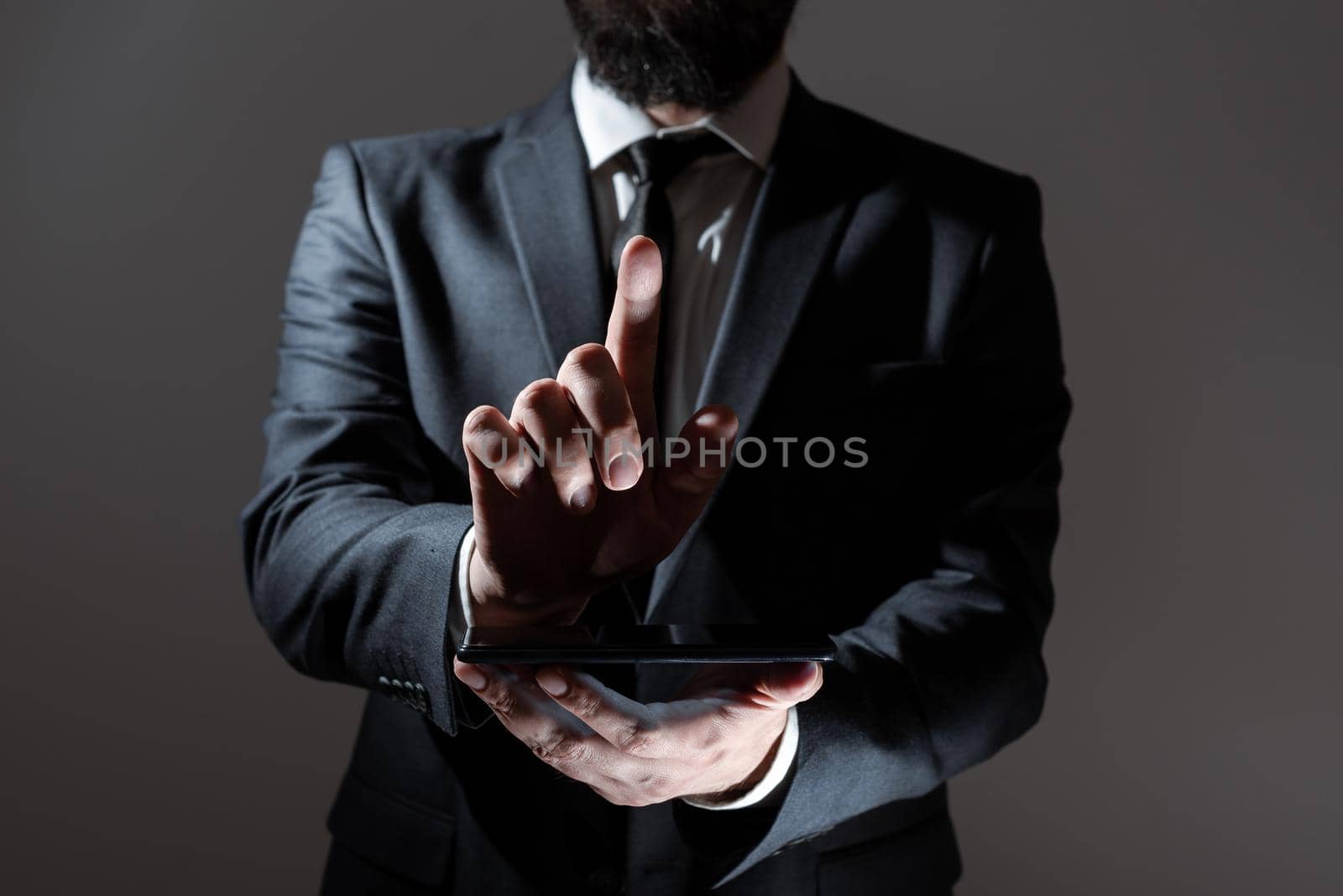 Man Holding Tablet And Pointing With One Finger On Important Message.