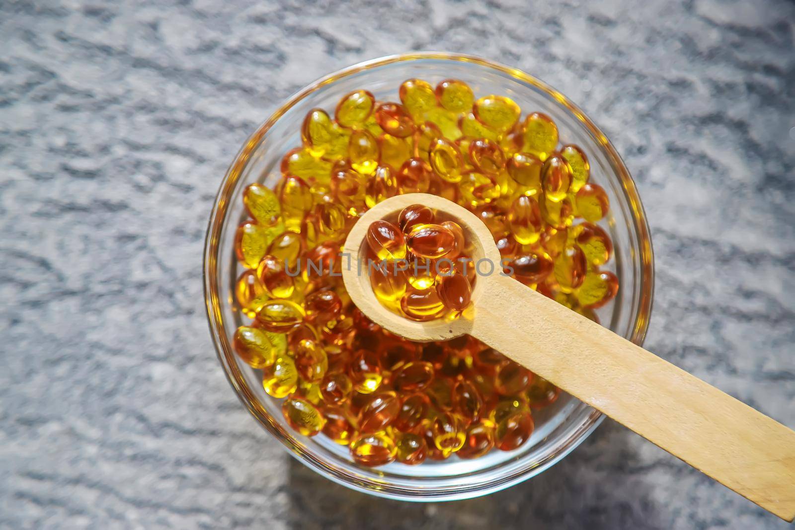 Vitamin D from fish oil capsules. Selective focus medical