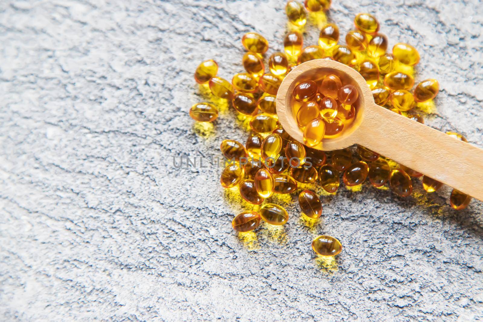 Vitamin D from fish oil capsules. Selective focus medical