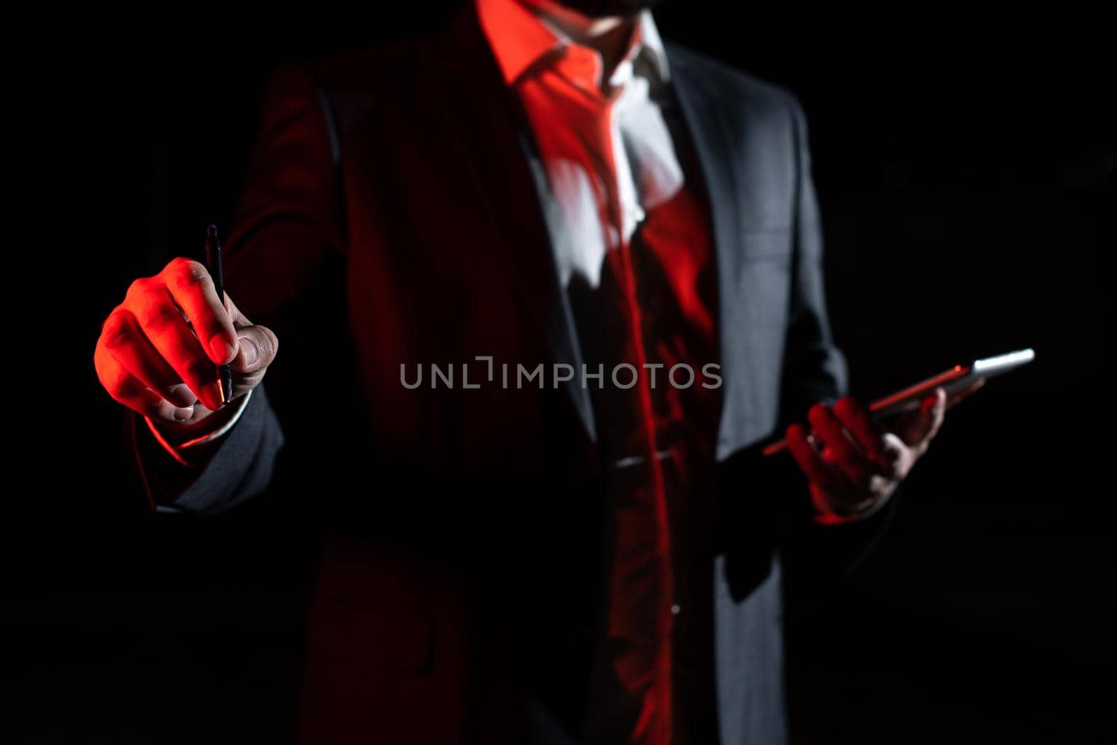 Businessman Holding Tablet And Pointing With Pen On Important Message.