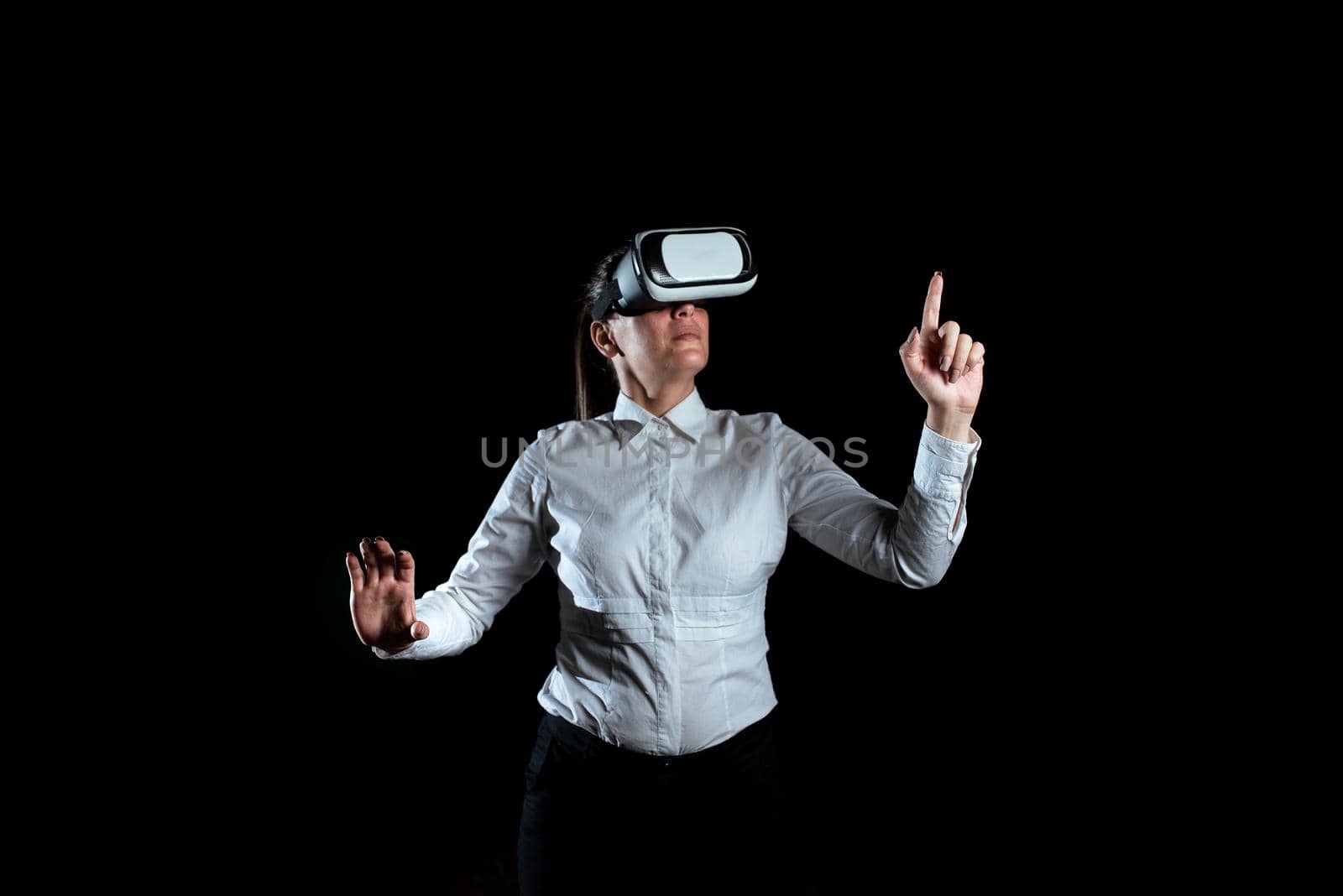 Woman Wearing Virtual Reality Simulator And Presenting Modern Technology.