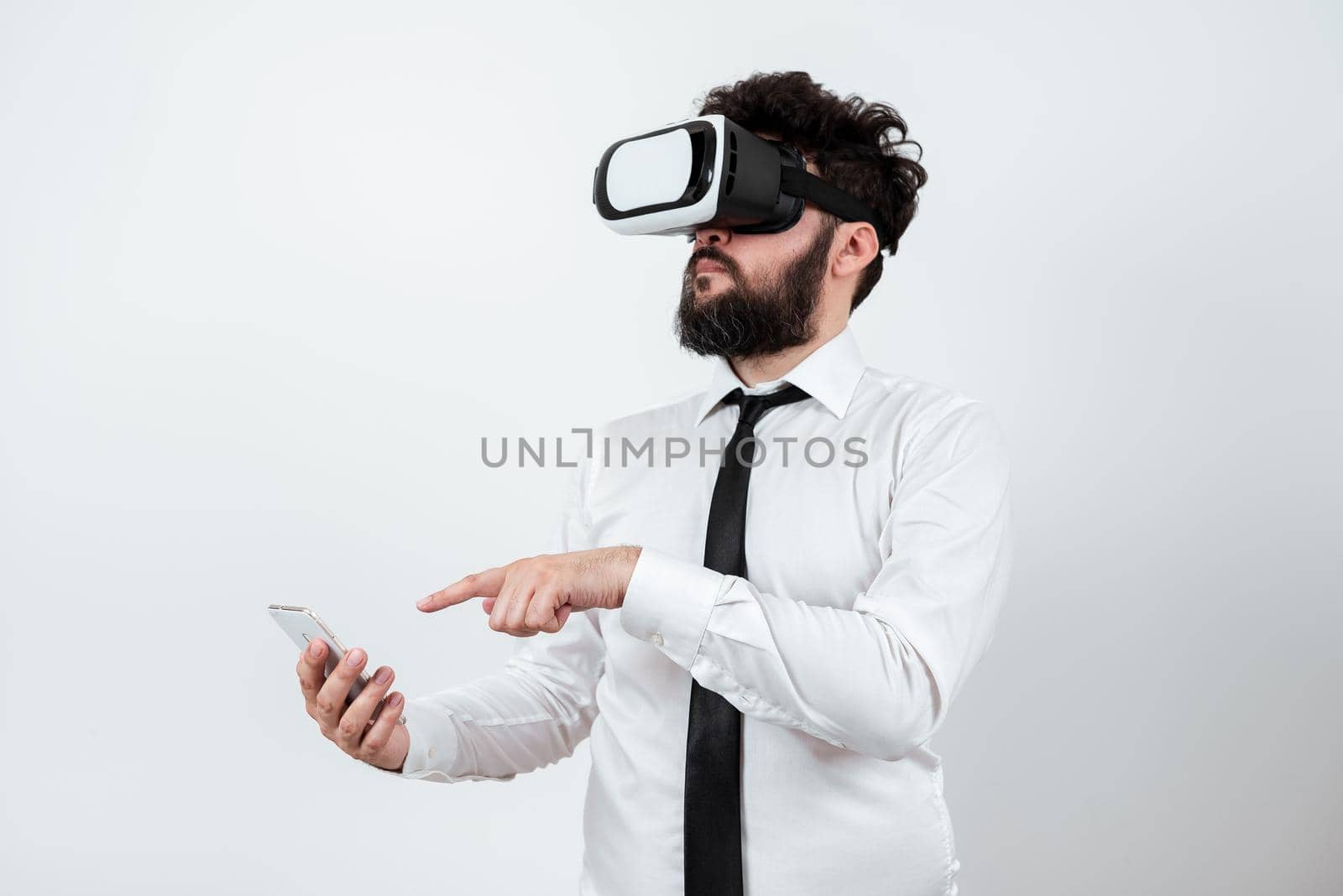 Man Holding Mobile Phone, Wearing Vr Glasses And Pointing On New Idea.