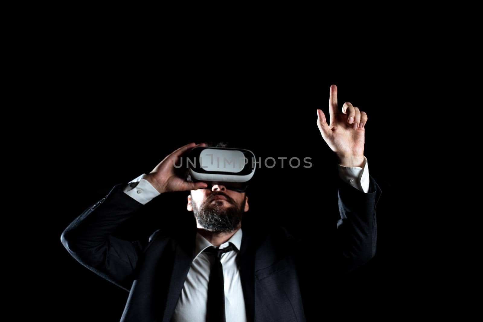 Man Wearing Virtual Reality Simulator Raising Hand During Training.