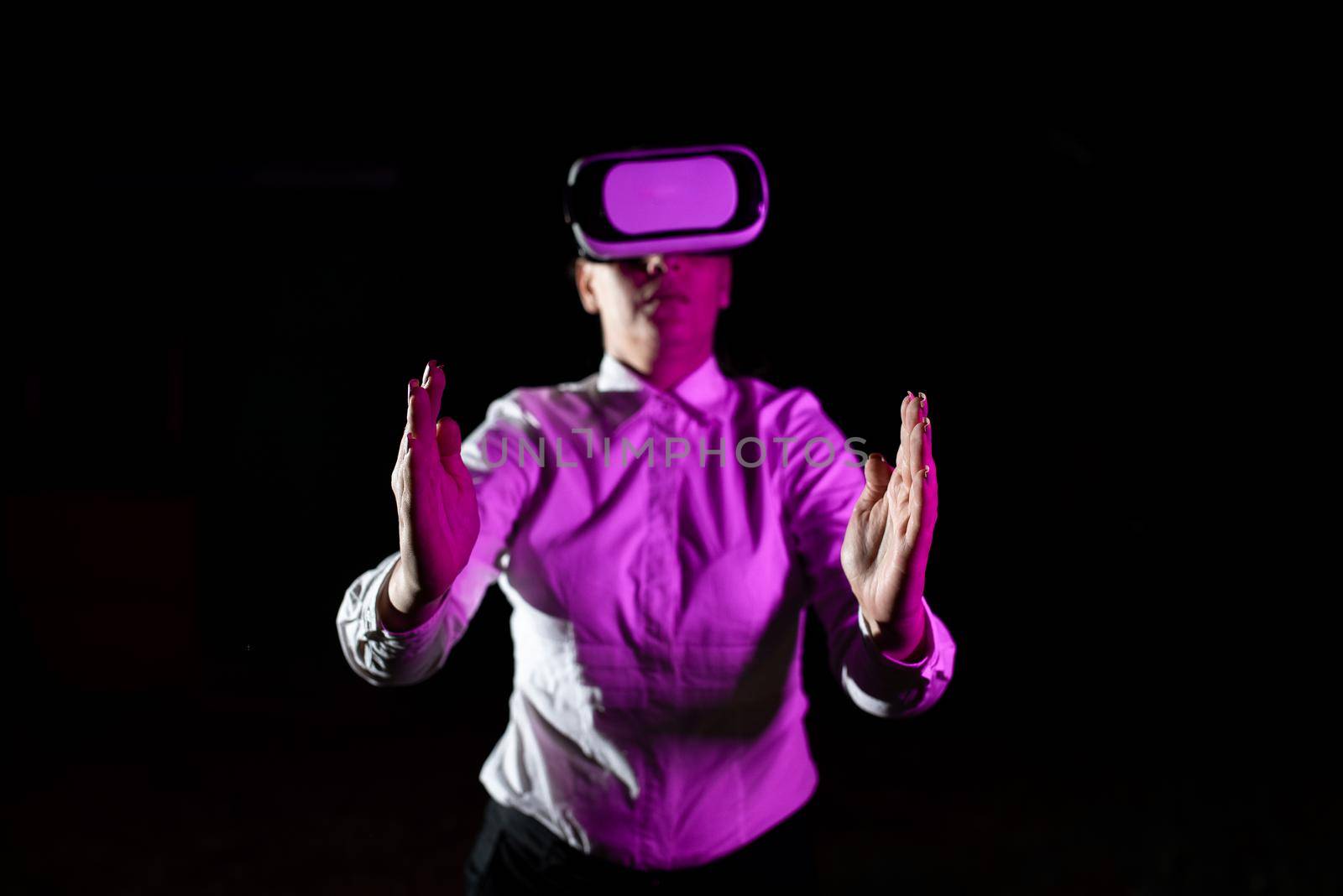 Woman Using Virtual Reality Simulator And Gesturing During Training.