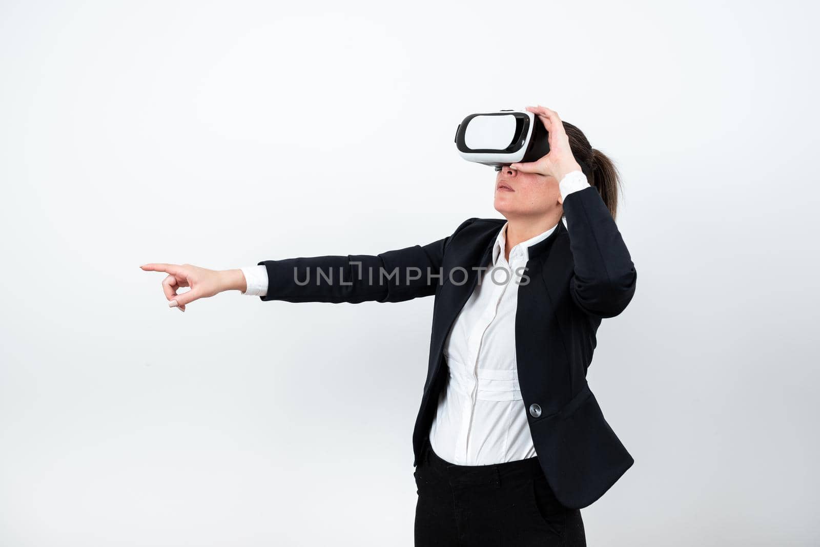 Woman Wearing Vr Glasses And Pointing On Important Message With One Finger.