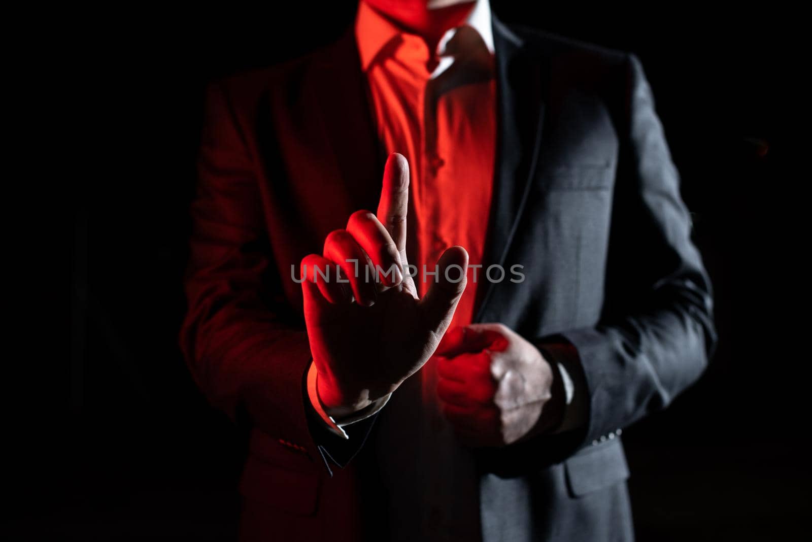 Businessman Pointing With One Finger On Important Message. Executive In Suit Presenting Crutial Information. Gentleman Showing Critical Announcement. by nialowwa