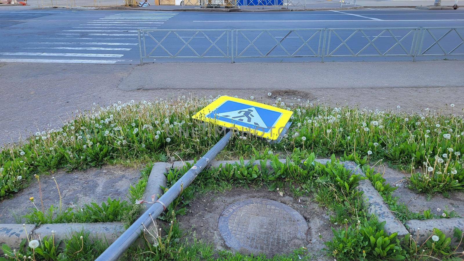 Repair installation of a road sign pedestrian crossing.