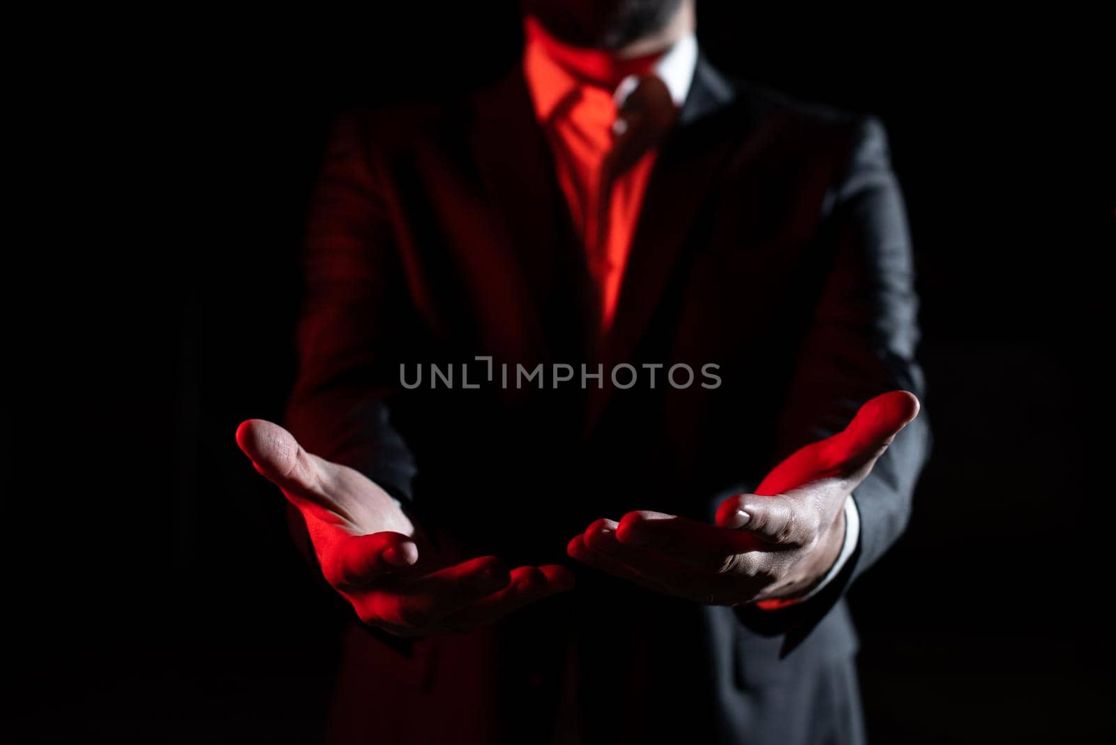 Businessman Holding And Presenting Important Informations On Hands.