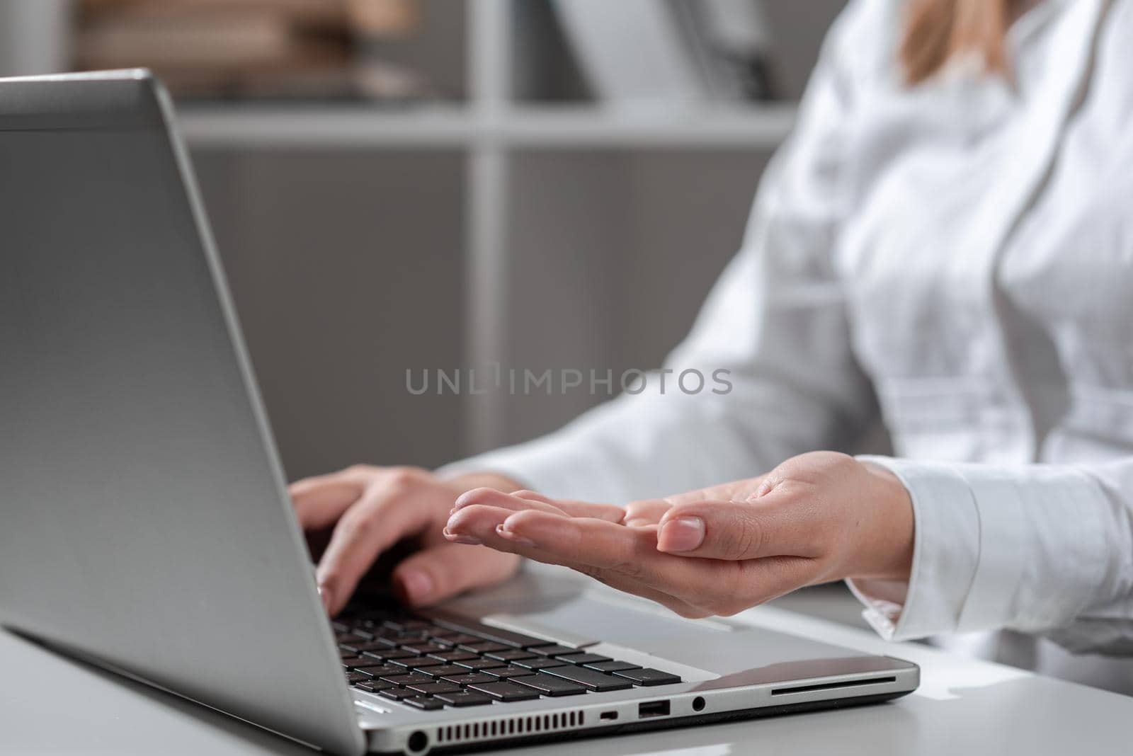 Woman Typing Recent Update On Lap Top And Holding Important Ideas Over Hand