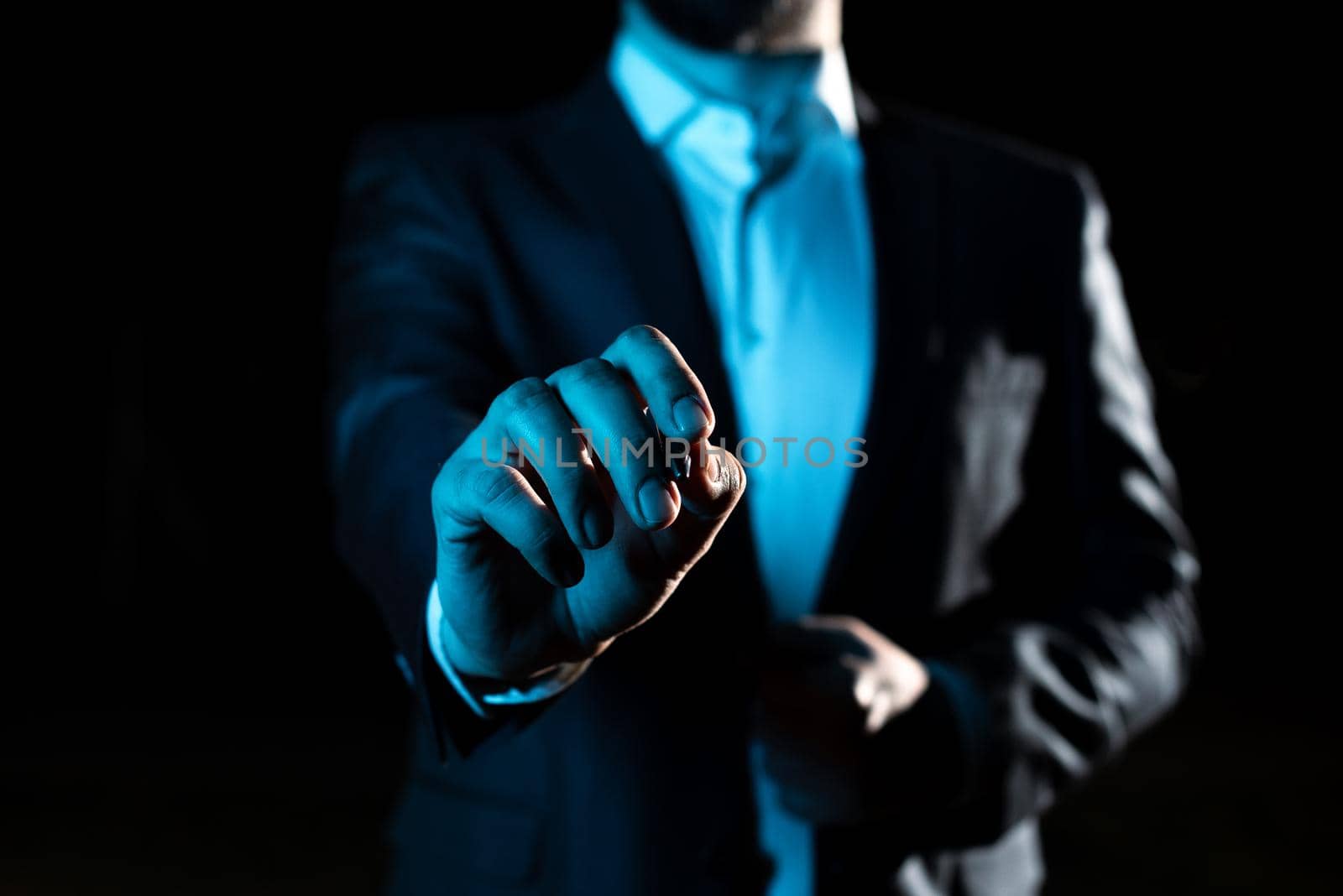 Businessman Pointing Important Informations With Pen In Hand.