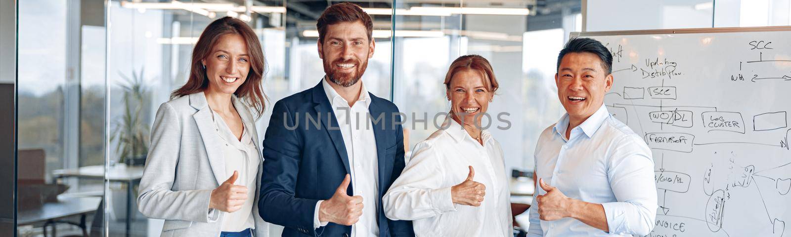 Office employees group showing thumbs up looking at camera, happy professional multicultural team.