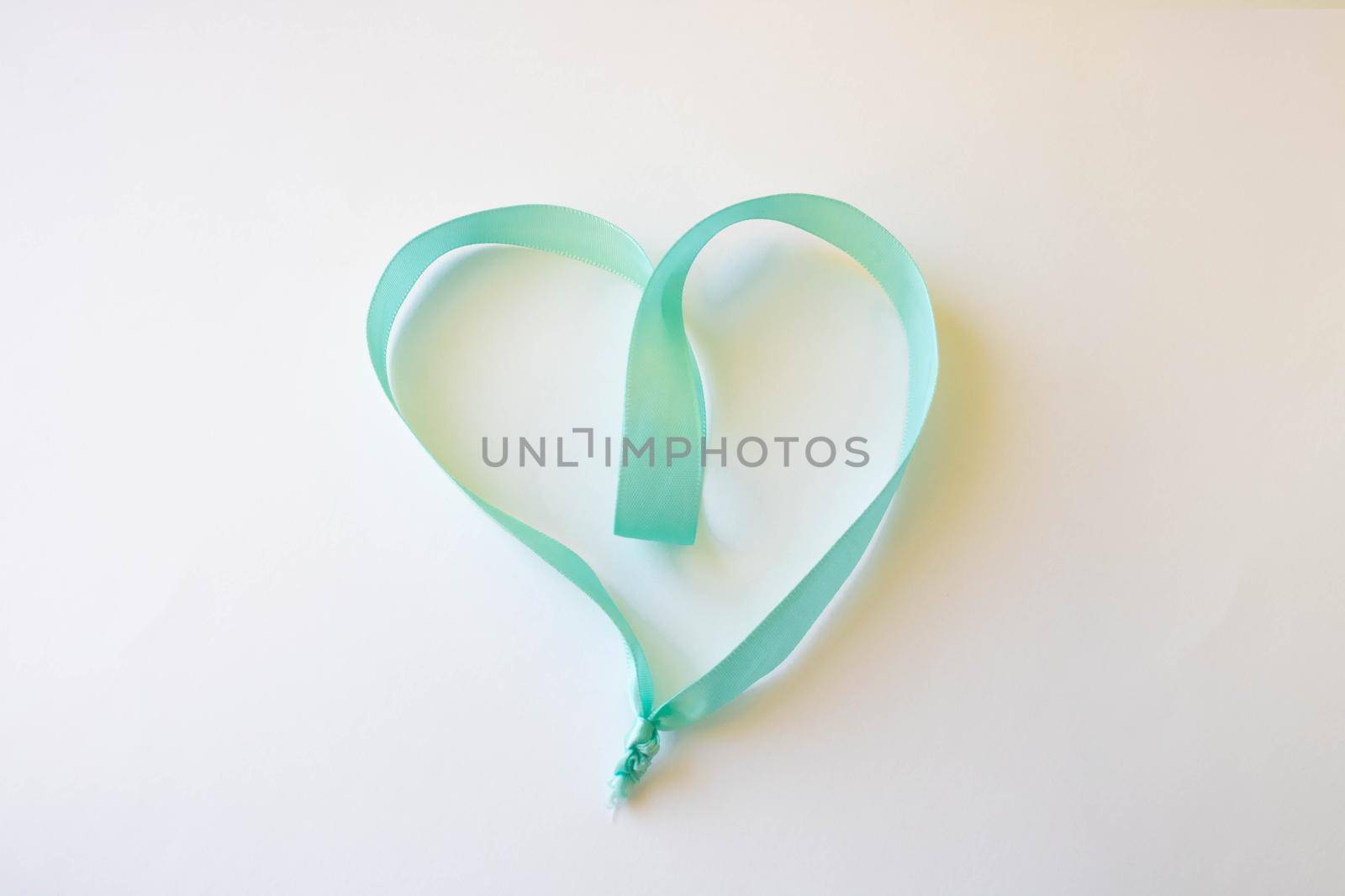Happy Valentine's Day. A heart made of blue ribbon on a white background. Valentine's Day Concept.