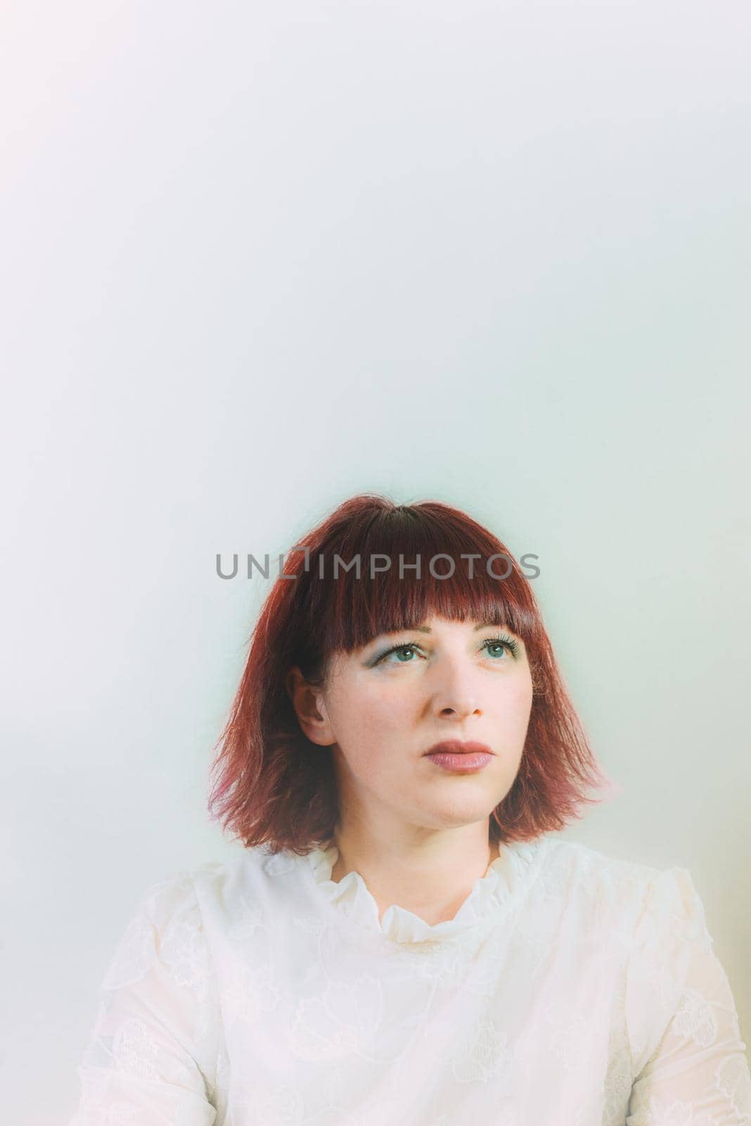 expressive young red haired woman studio shots