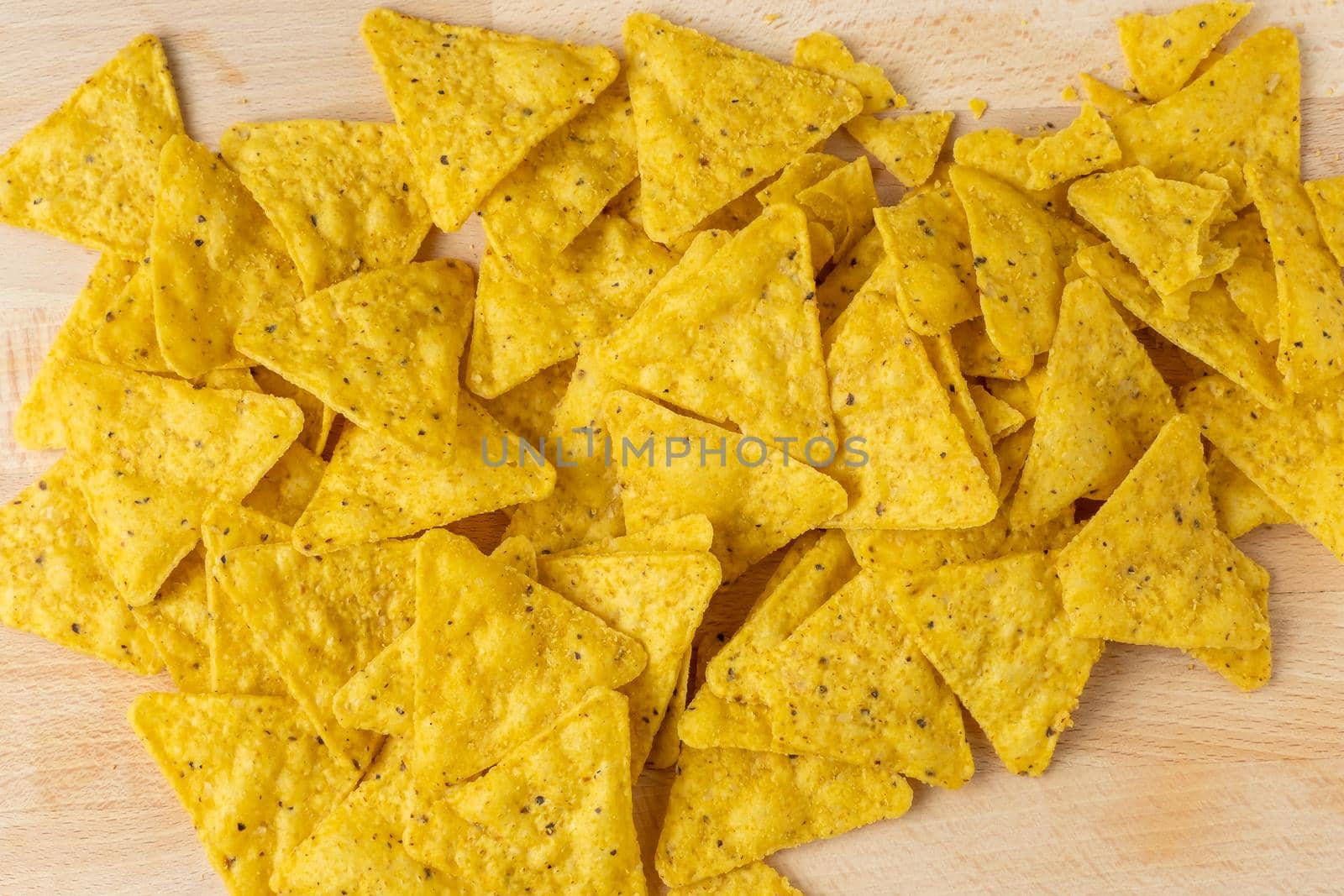 Mexican nachos chips on the wooden board by xtrekx