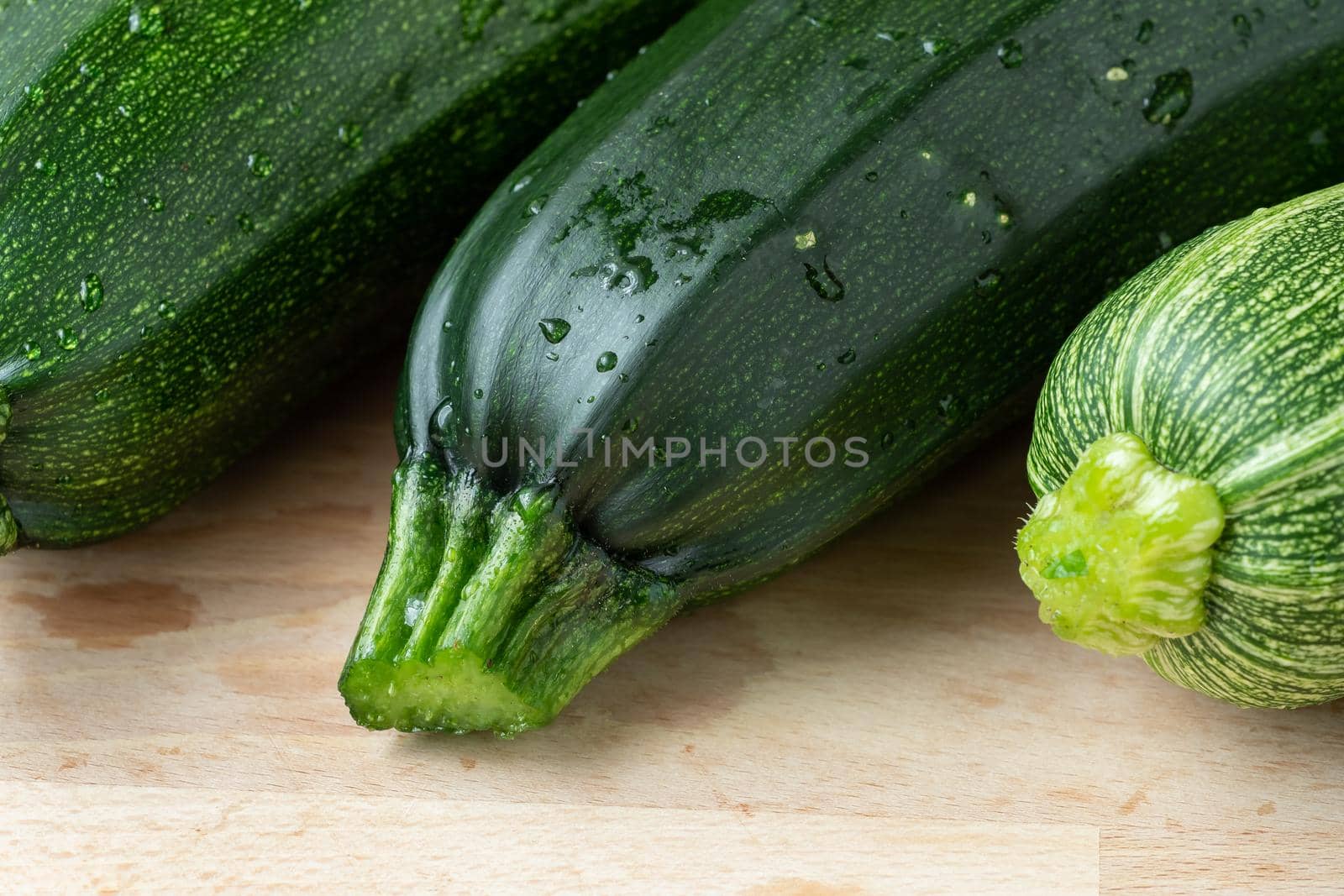 Fresh zucchini on cutting board by xtrekx