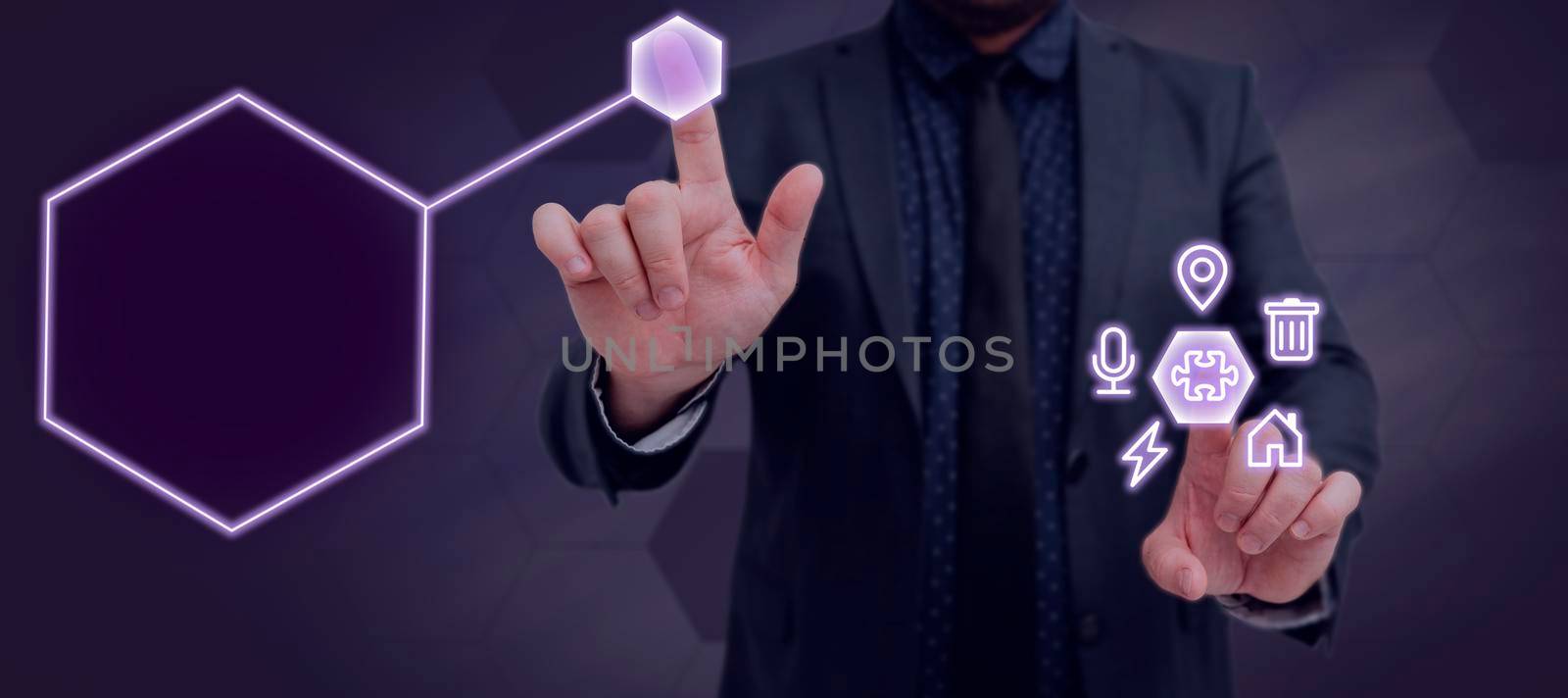 Businessman Pointing With Two Fingers On S And Presenting Crutial Messages. Standing Man In Suit Showing Important Informations. Executive Displaying New Data. by nialowwa