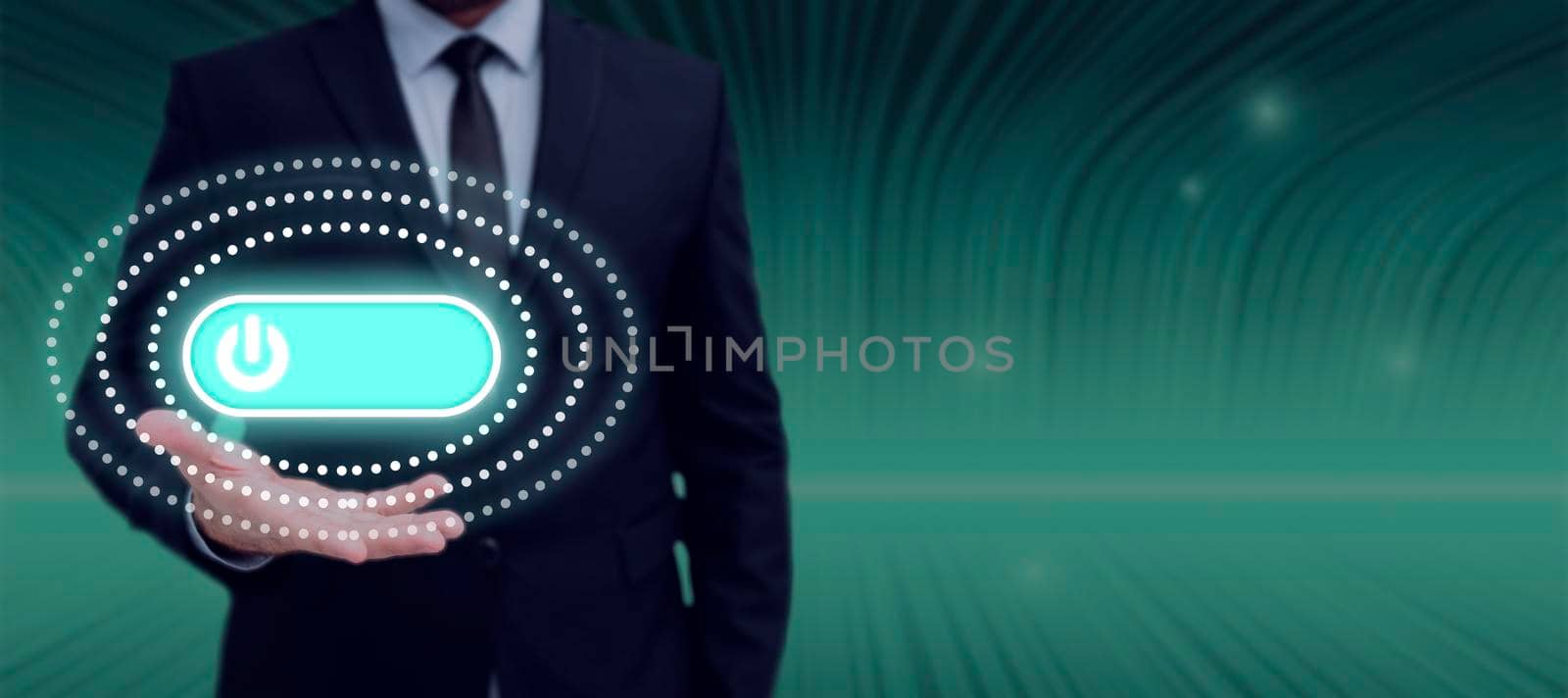 Businessman Presenting With One Hand Circular Patterns With Power Button In Futuristic Design. Businessman In Suit Showing Important Messages And New Concepts. by nialowwa