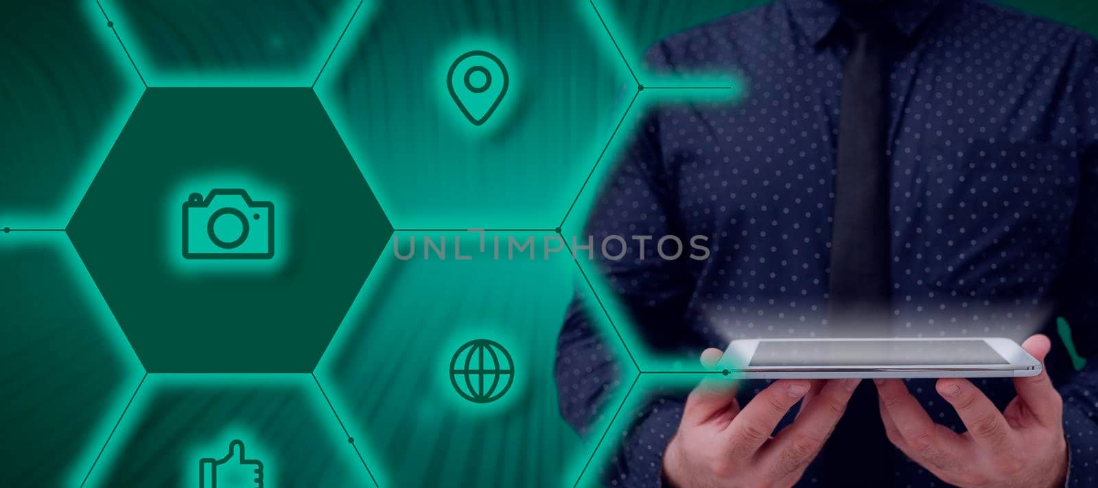 Businessman Holding A Tablet And Projecting A Camera In A Graphic Hexagone Design. Man In A Necktie Presenting Creative Photography And Digital Information. by nialowwa