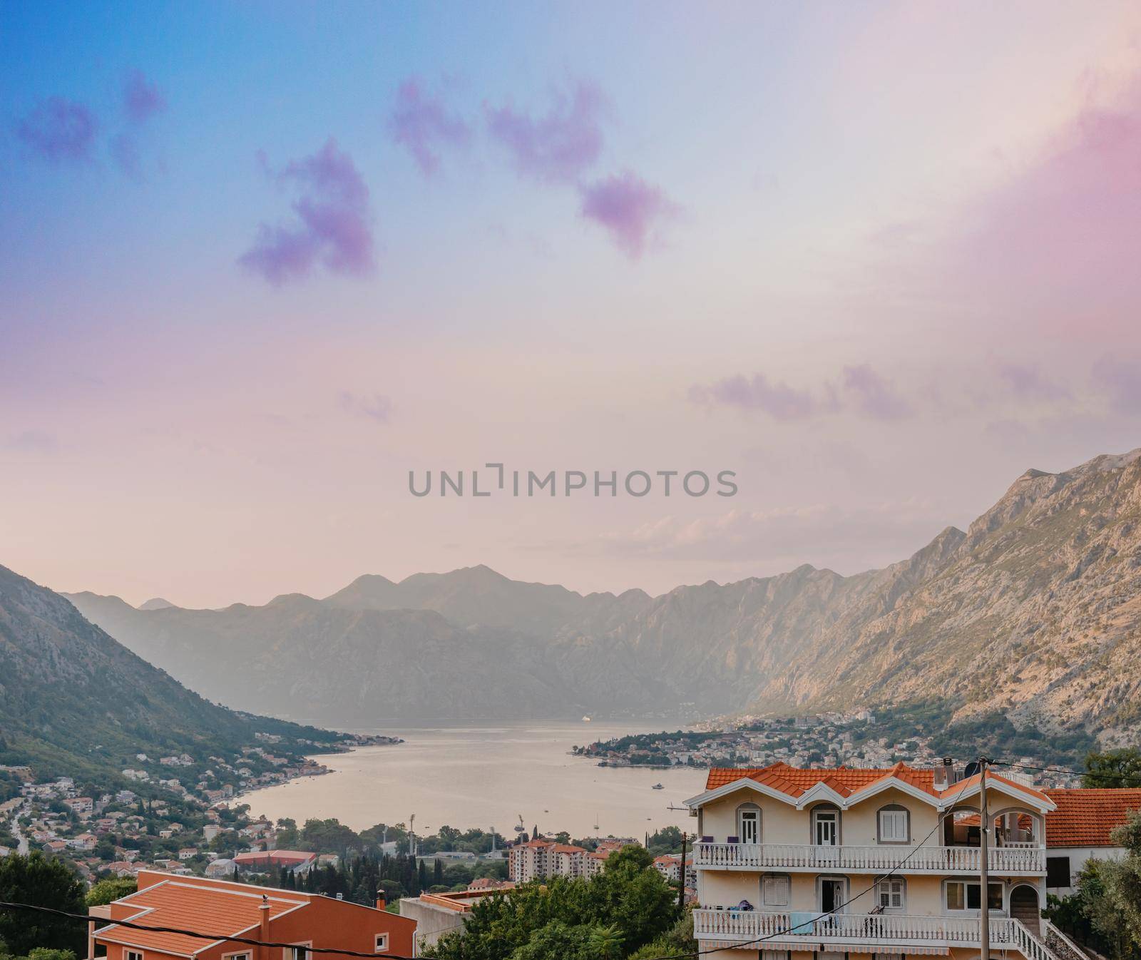 Sunset, beautiful landscape with silhouettes of trees. Travel concept. Montenegro, Kotor Bay. Sunset at Kotor Bay Montenegro. View of the sunset in Boko-Kotor Bay in Montenegro.