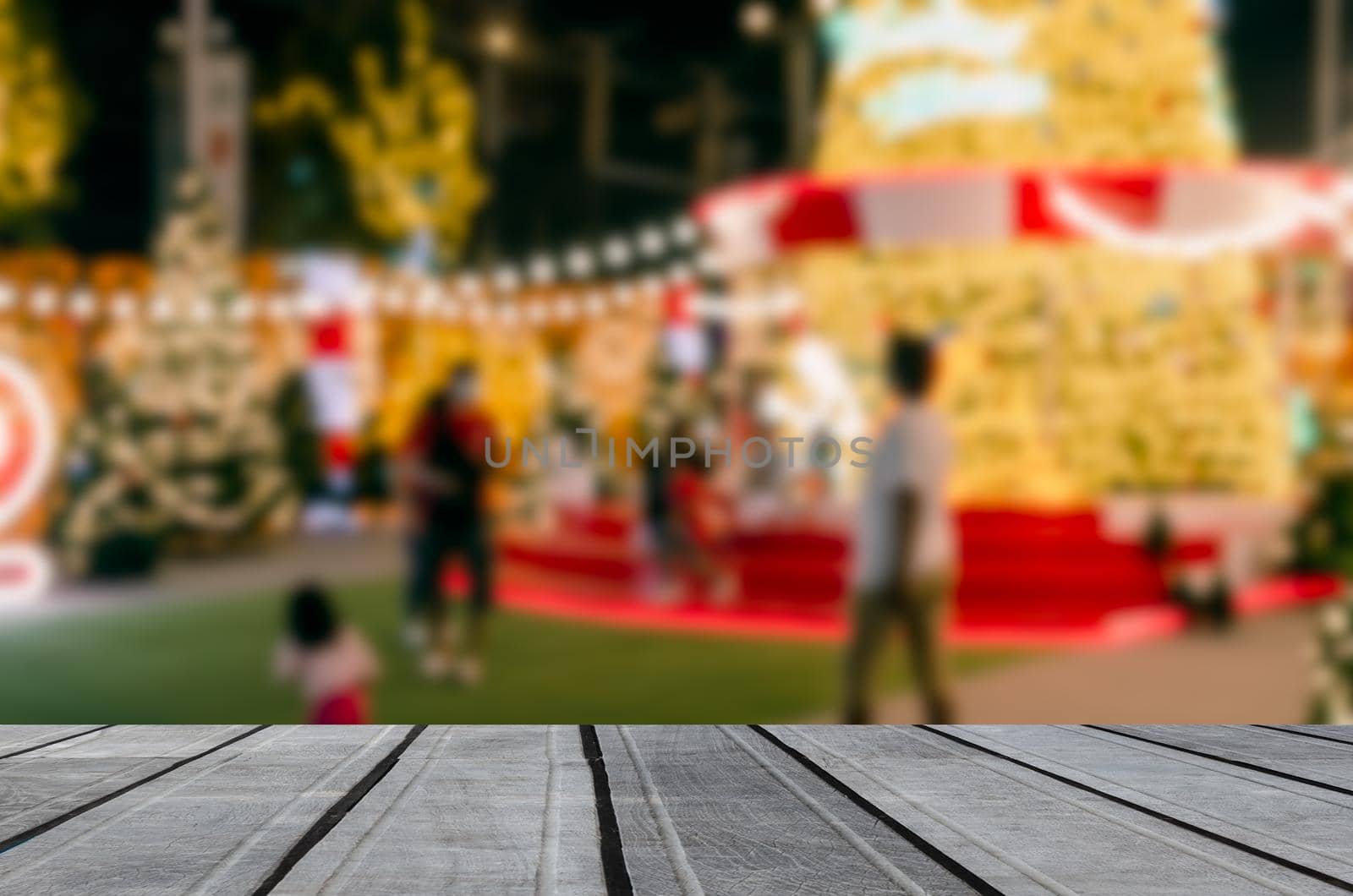 wood table top product empty counter abstract blur background person bokeh light festive decoration display vintage retro tone.