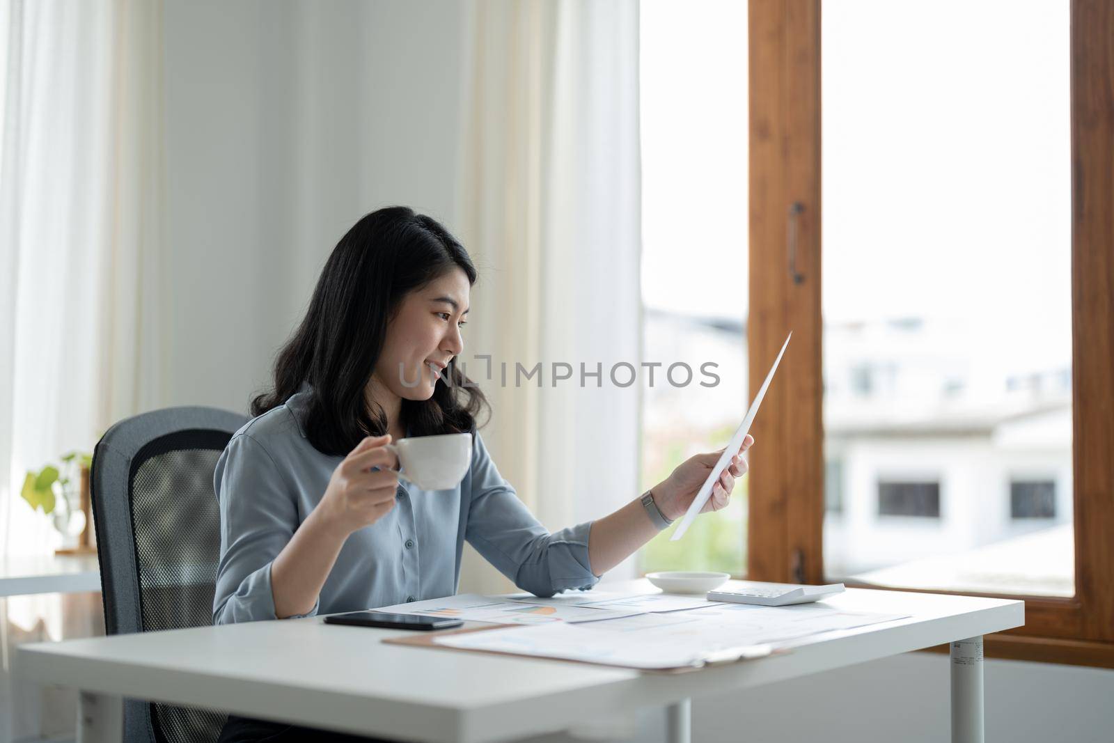 Businesswoman advisor planning analyze investment and marketing on tablet in office