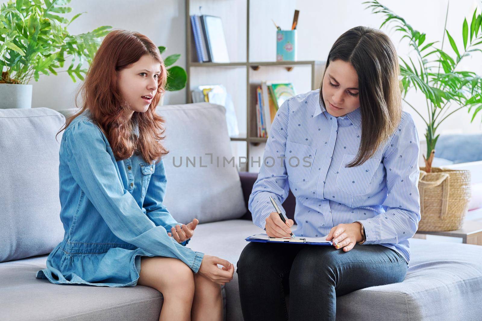 Female professional child psychologist working with preteen girl in office. Childrens mental health, problems at school family, individual therapy. Psychology psychiatry social difficulties childhood