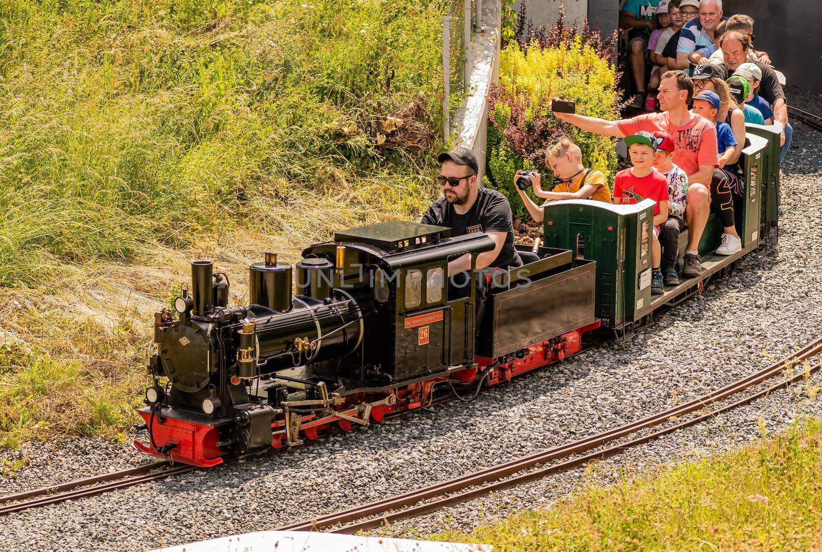 A set of steam locomotive model with many tourists by rostik924