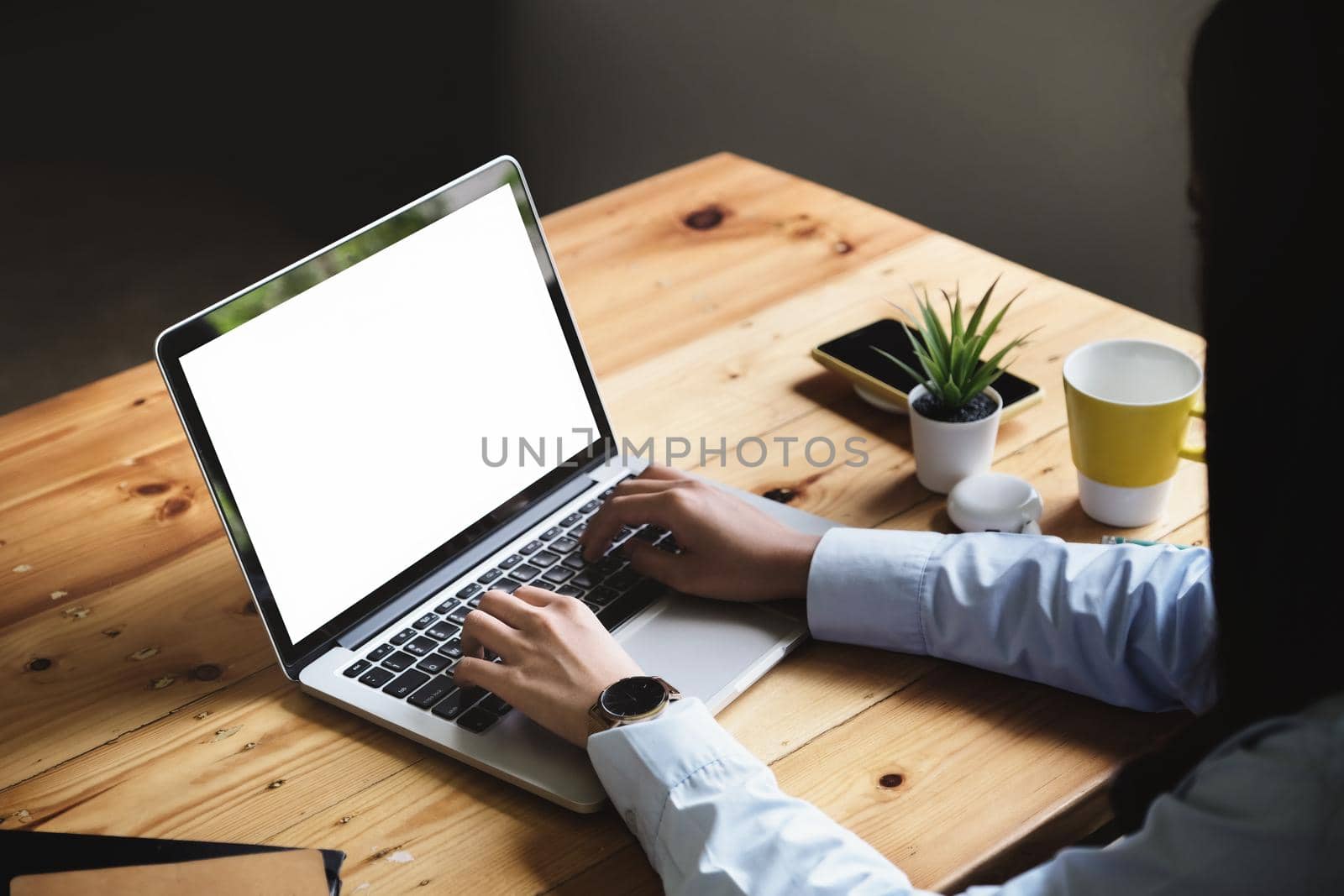 freelance concept, woman using computers laptop on wooden desk blur background. Laptop computer with blank screen and can be add your texts or others on screen