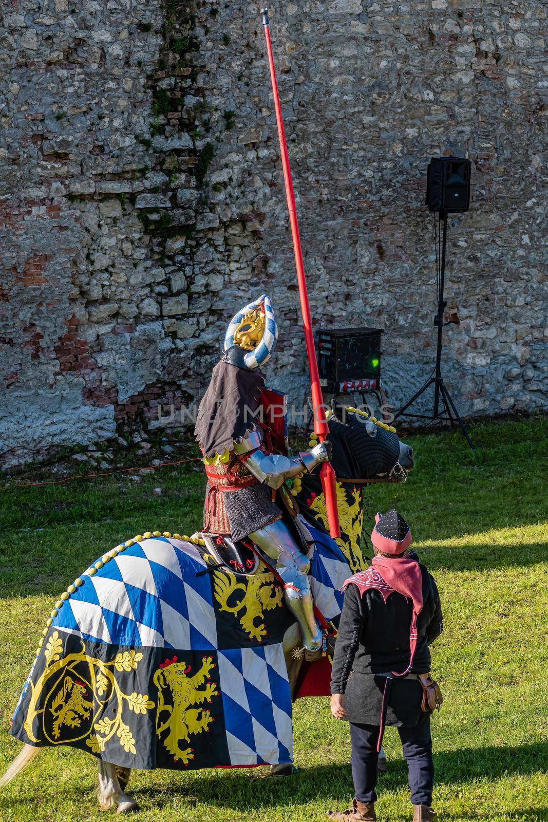 WYWAR CASTLE FEST, demonstrations of knightly fights A knight on horseback and a squire with a spear waiting for an opponent