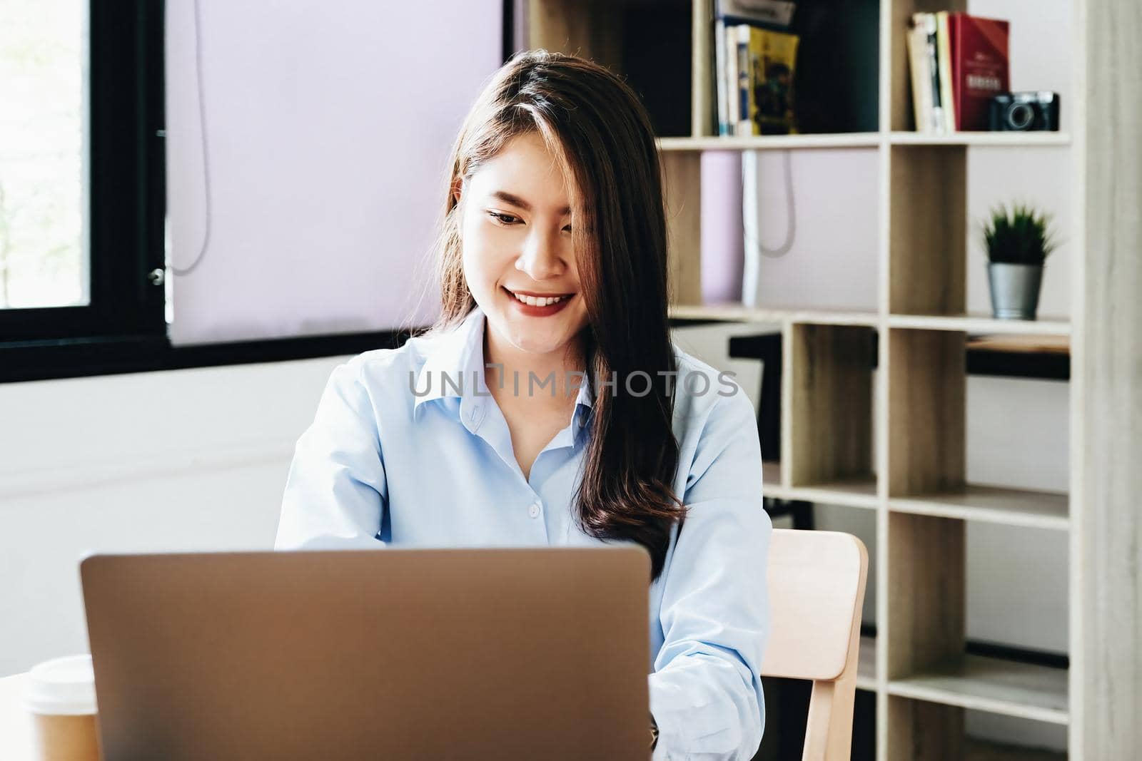 freelance concept,female using computers to design work as ordered by customers. by Manastrong