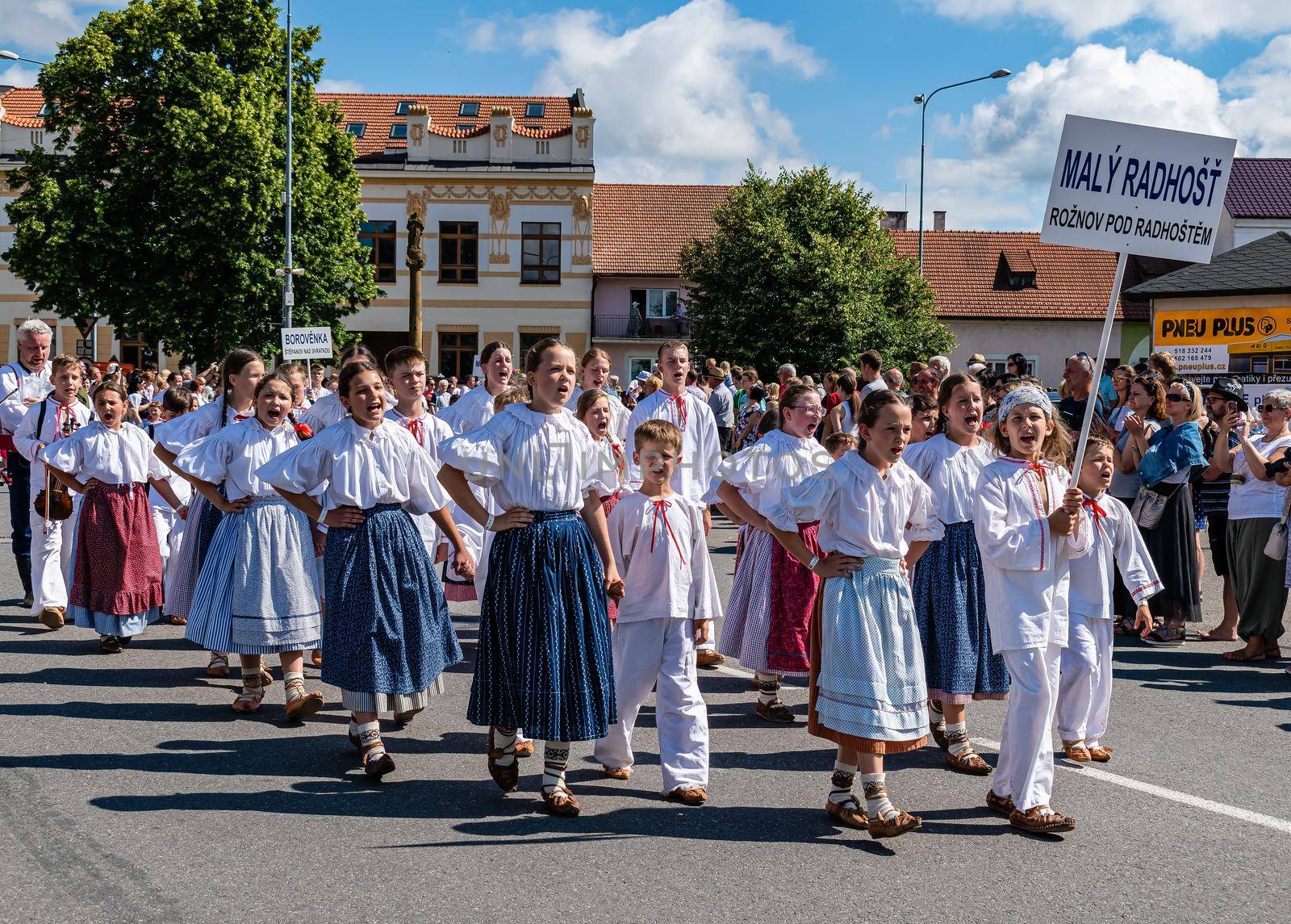 Straznice, Czech Republic - June 25, 2022 International Folklore Festival. Cute children in folk costumes in the parade at the festival