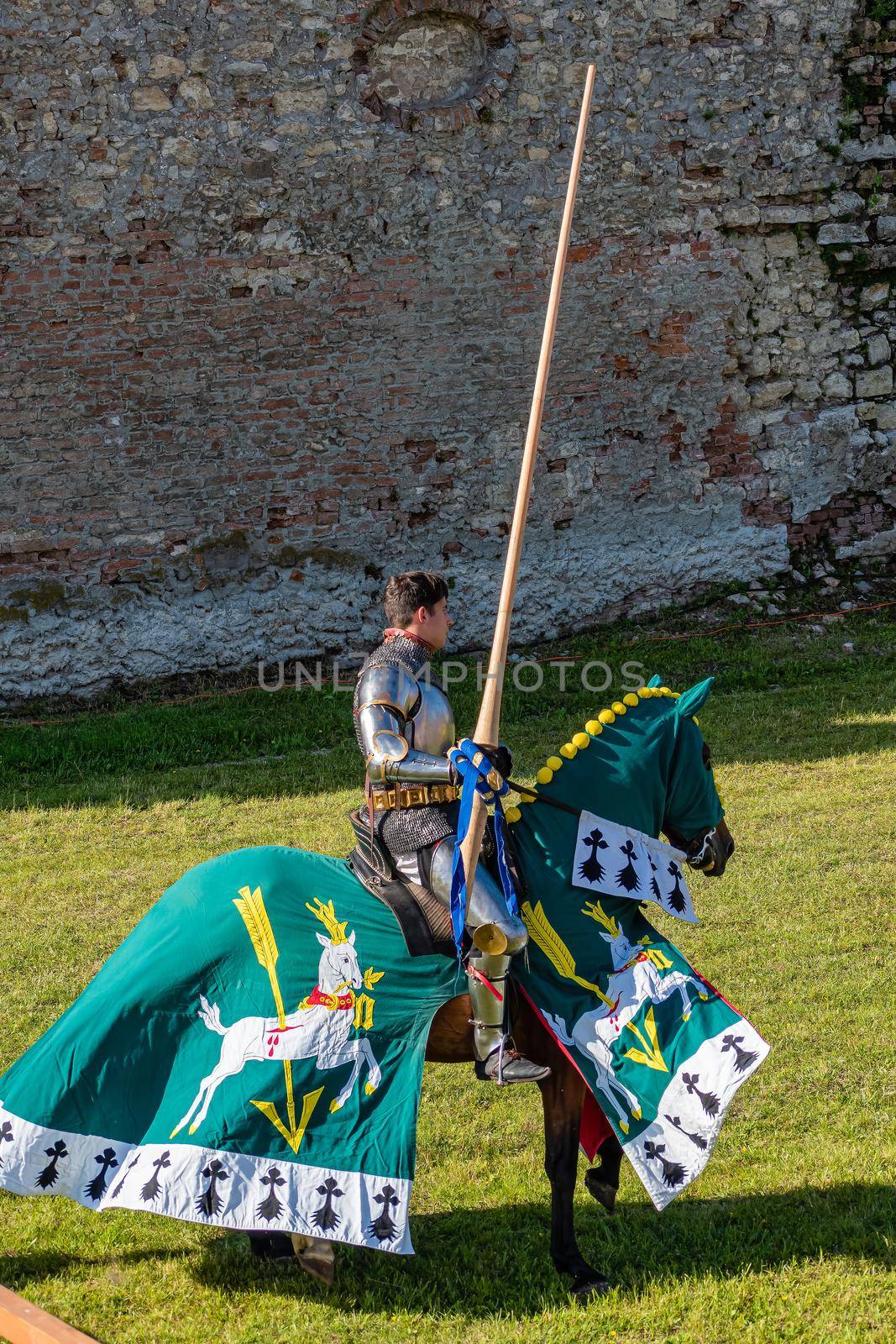 WYWAR CASTLE FEST, demonstrations of knightly fights Knight on a horse with a spear, waiting for an opponent