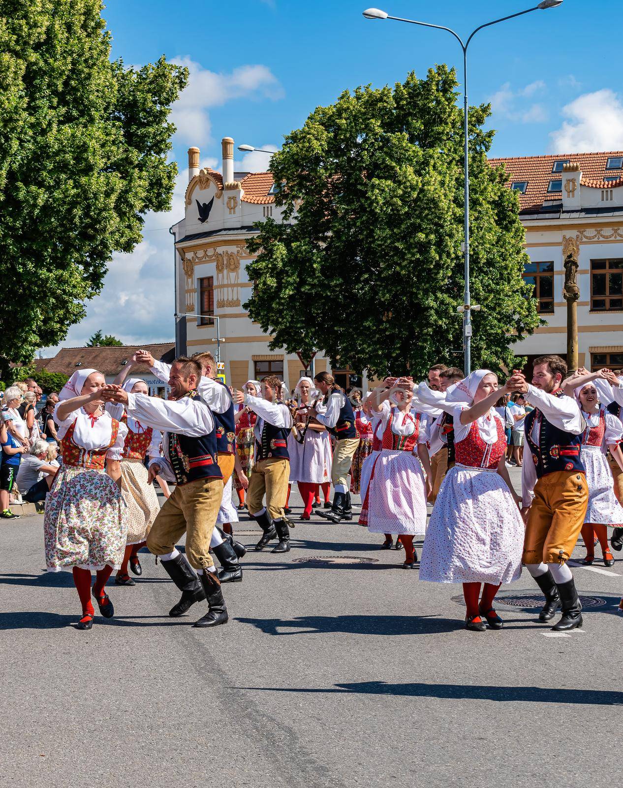 Straznice, Czech Republic - June 25, 2022 International Folklore Festival. Young people in folk costumes dance in a procession