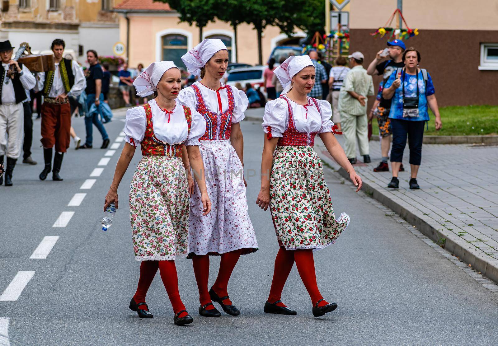Straznice, Czech Republic - June 25, 2022 International Folklore Festival Three girls in folk costumes at the festival