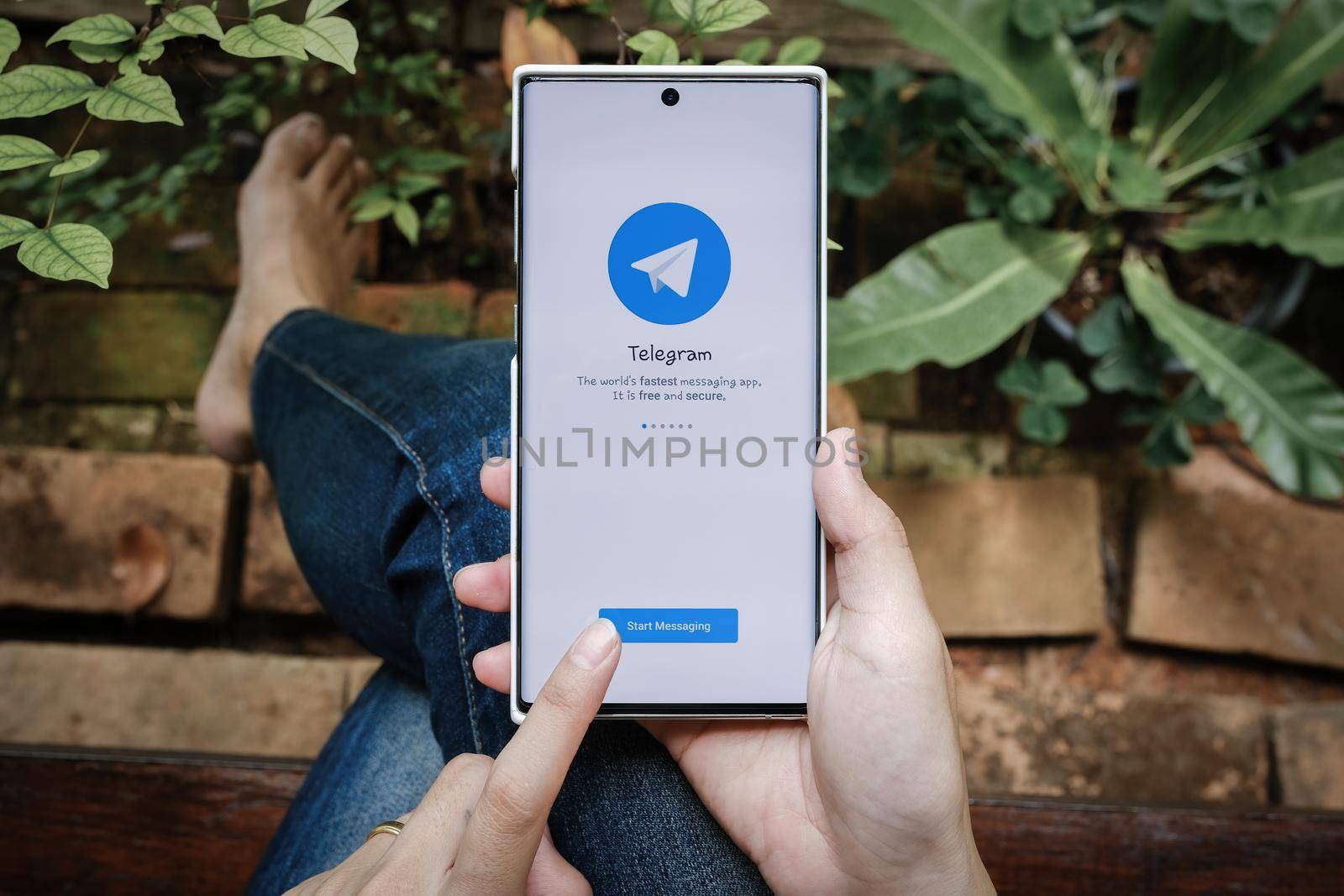 Chiangmai, Thailand July 09 2021 : Telegram application icon smartphone mobile close-up. Telegram app icon. Telegram is an online social media network. by Manastrong