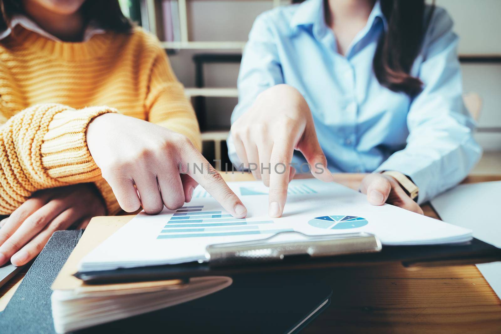 A female business consultant describes a marketing plan to set business strategies for women business owners