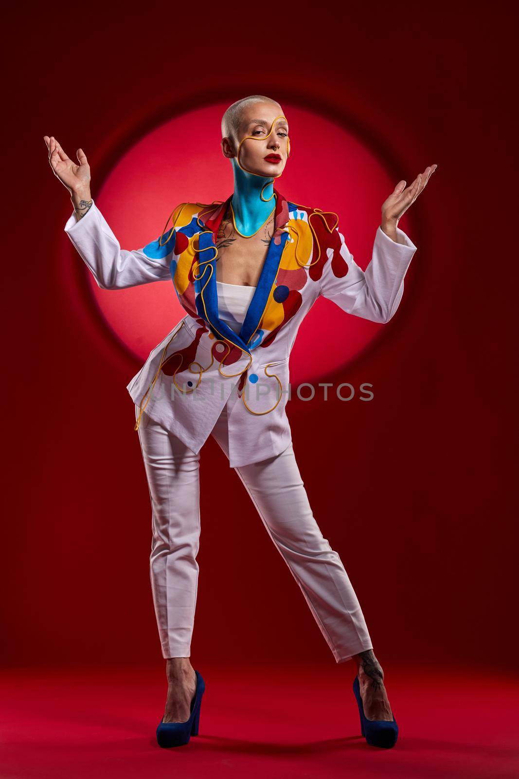 Behold the Queen of the palace. Studio shot of a stylish young woman posing against a red background