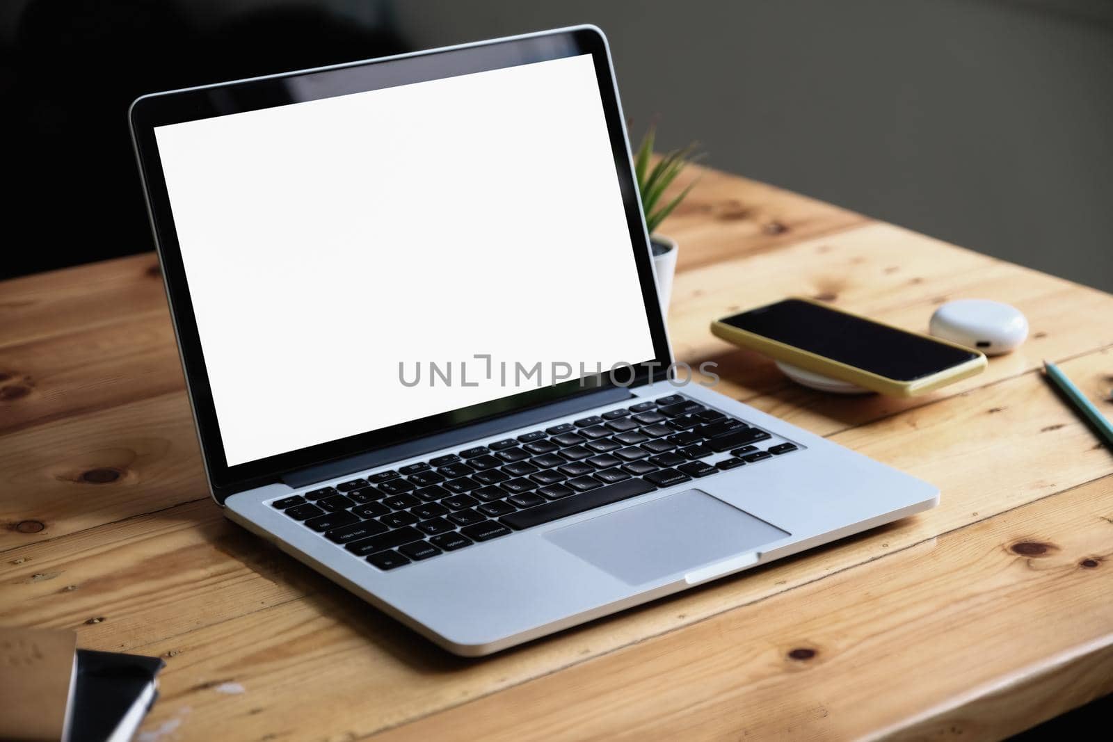 Close-Up laptop on wooden desk, Laptop computer with blank screen and can be add your texts or others on Laptop by Manastrong