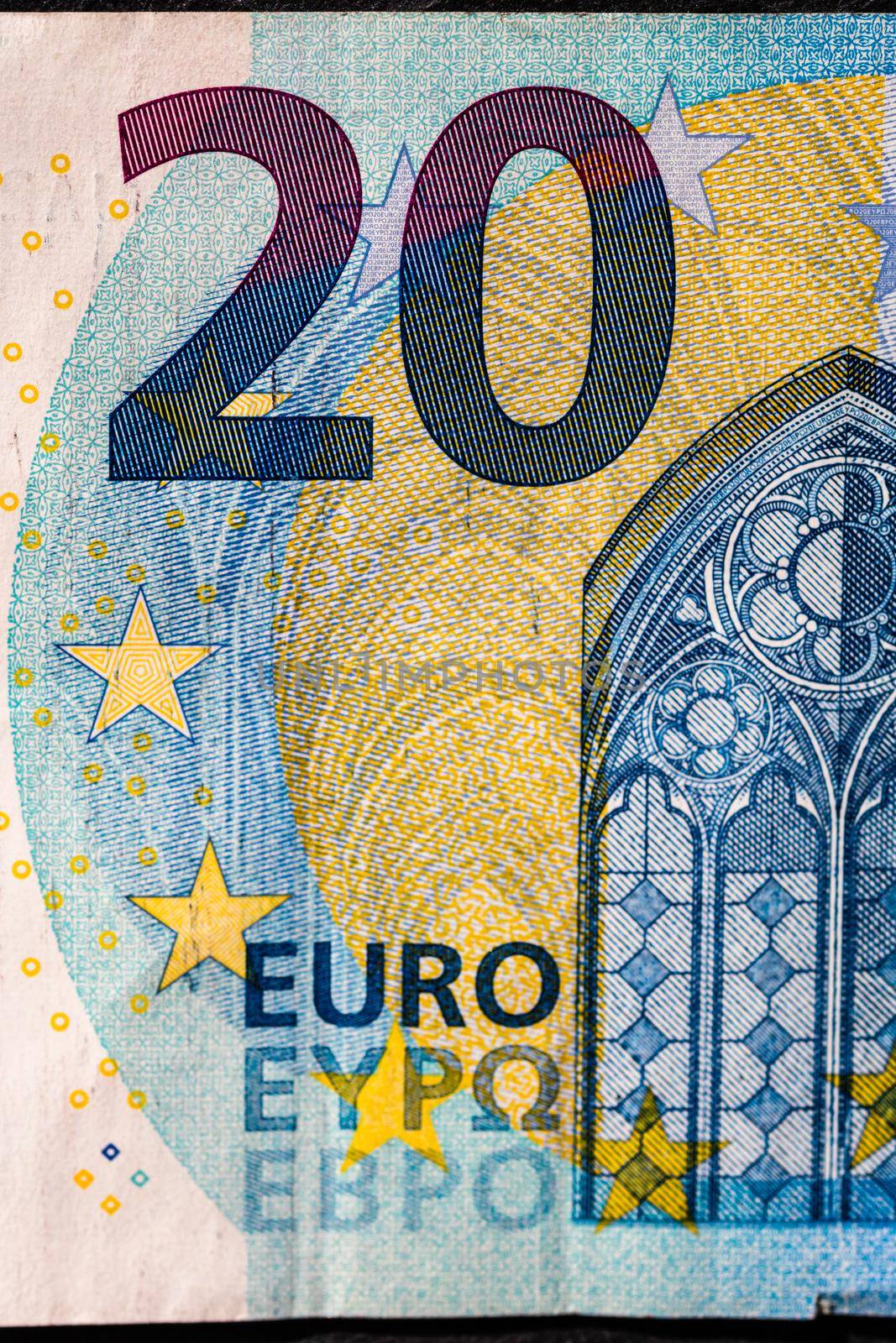 Selective focus on detail of euro banknotes. Close up macro detail of money banknotes, 20 euro isolated. World money concept, inflation and economy concept by vladispas