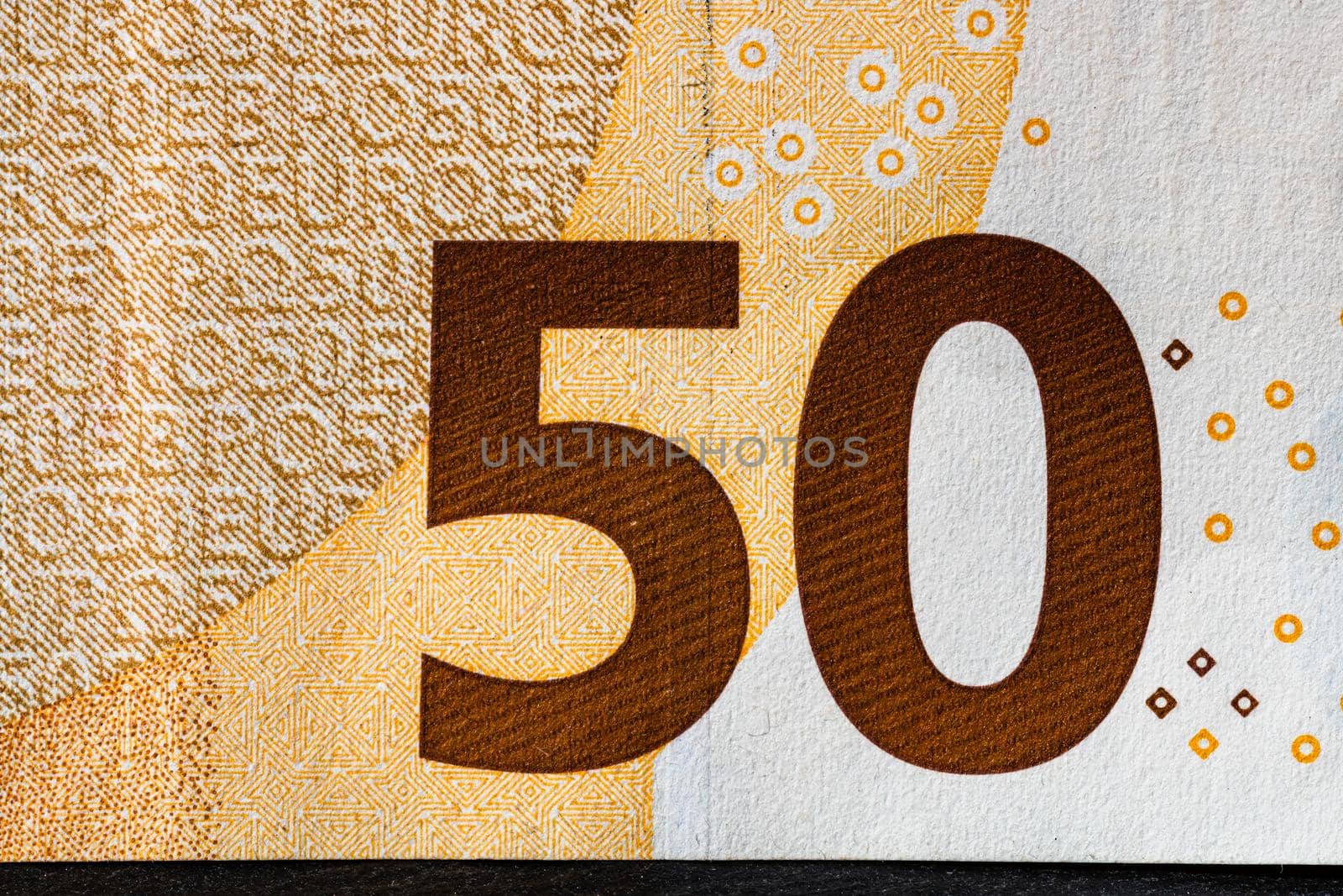 Selective focus on detail of euro banknotes. Close up macro detail of money banknotes, 50 euro isolated. World money concept, inflation and economy concept