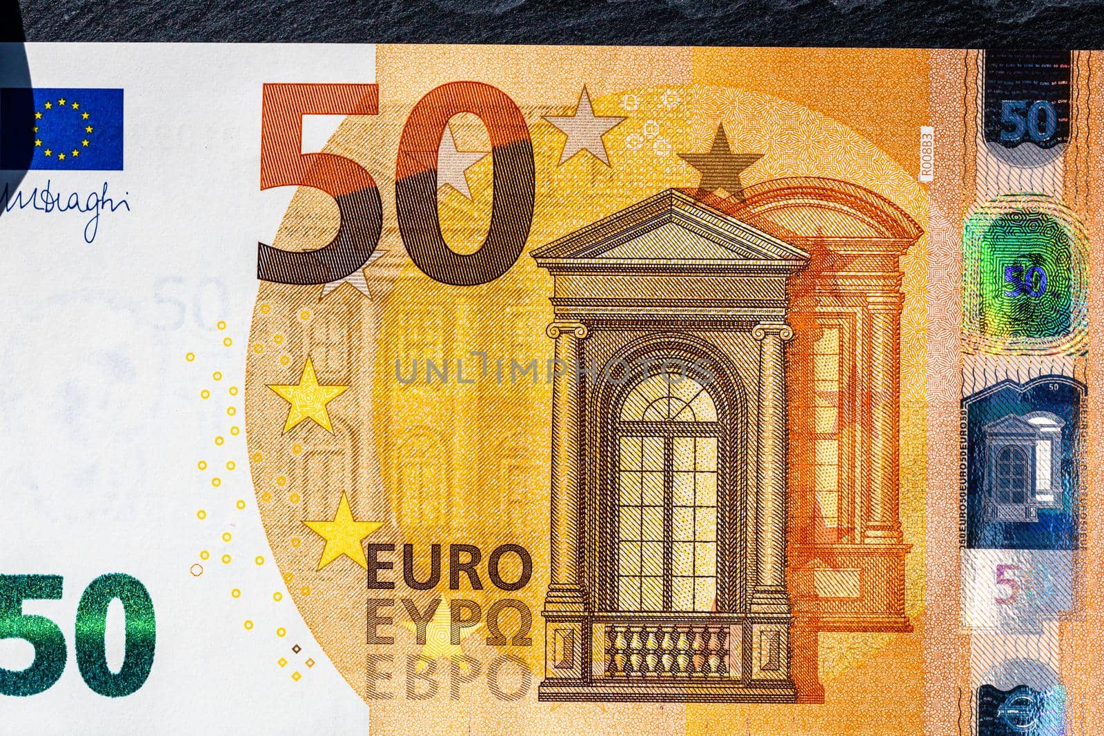 Selective focus on detail of euro banknotes. Close up macro detail of money banknotes, 50 euro isolated. World money concept, inflation and economy concept