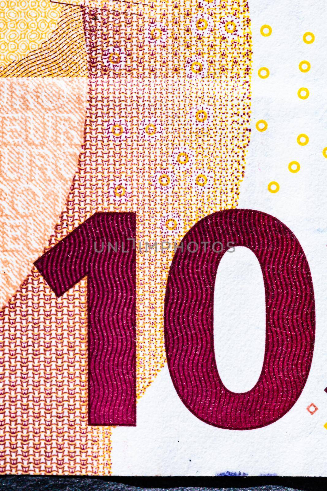 Selective focus on detail of euro banknotes. Close up macro detail of money banknotes, 10 euro isolated. World money concept, inflation and economy concept by vladispas