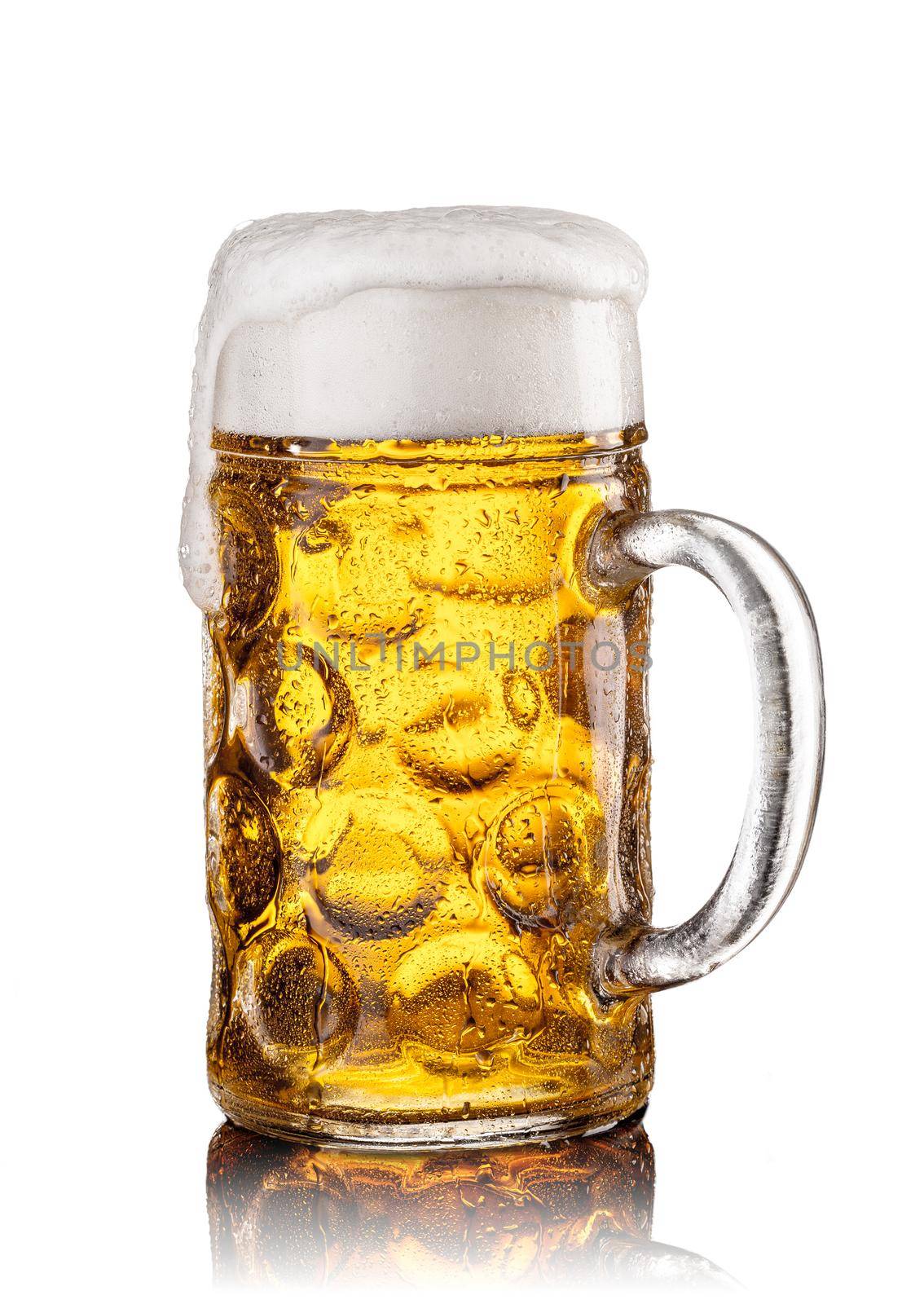 Mug with beer on white background. Beautiful foam and drops of moisture on a glass